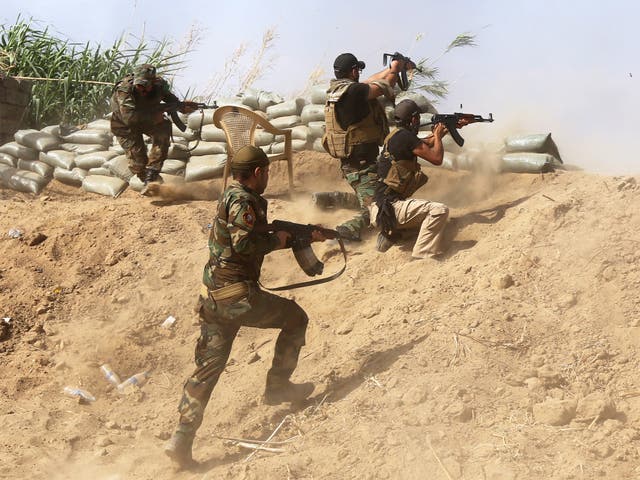 Iraqi Sunni fighters battling Isis forces on the outskirts of Iraq's Baiji oil refinery, about 200 kilometres north of Baghdad, on Monday