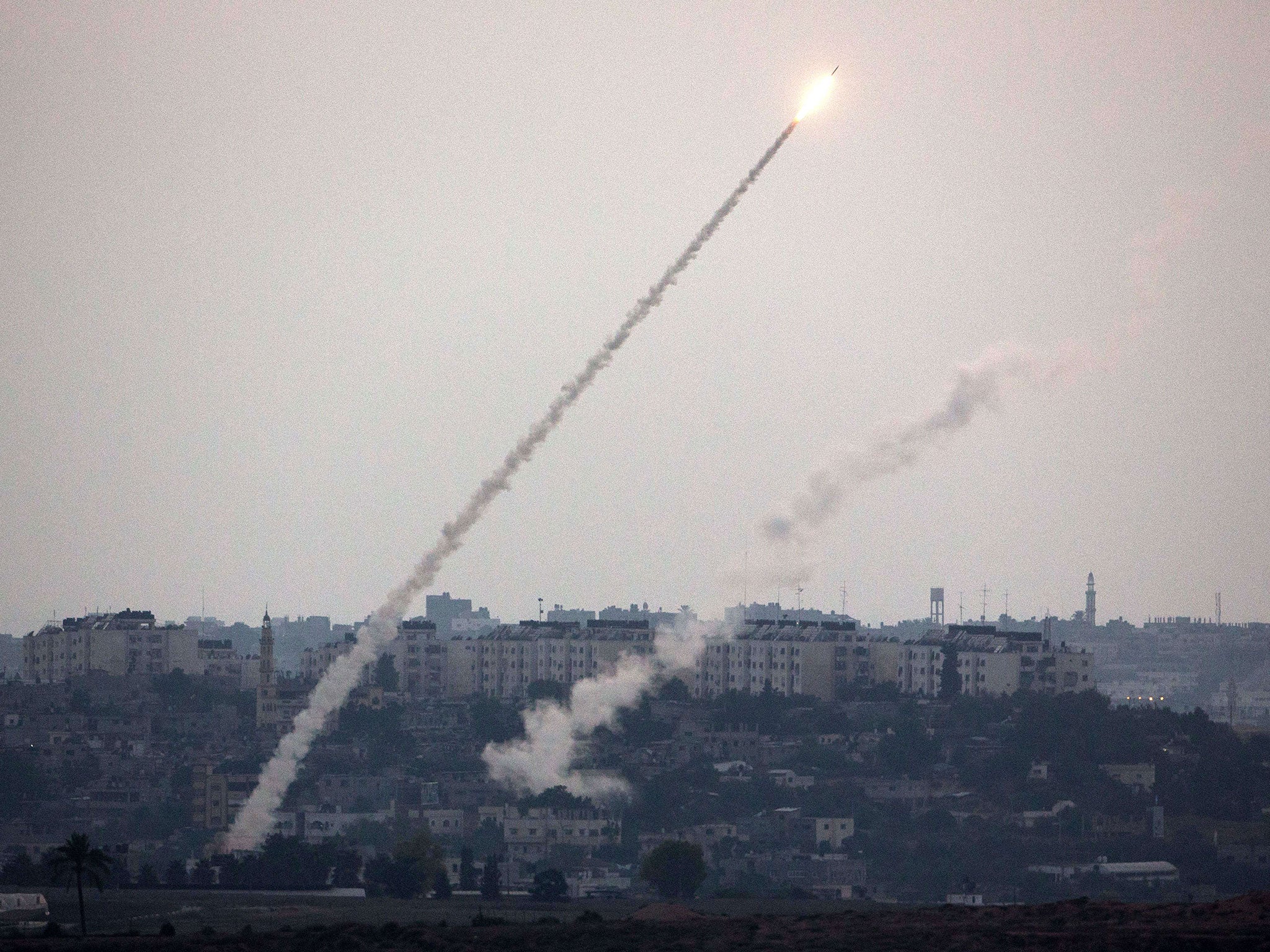 A picture taken from the southern Israeli Gaza border shows a rocket being launched from the Gaza strip into Israel, on July 11, 2014