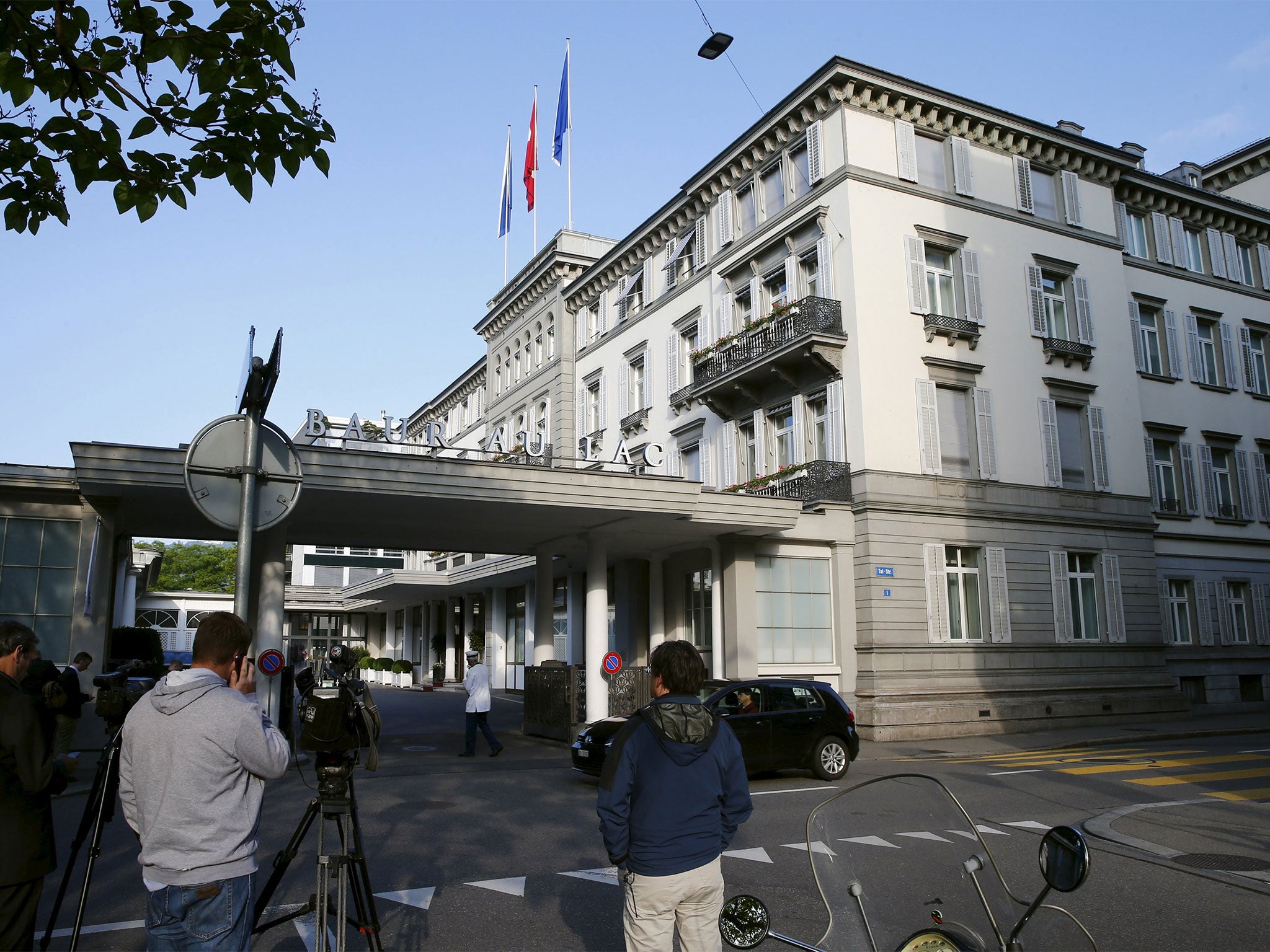 The officials were held after a dawn raid at the Baur au Lac hotel in Zurich