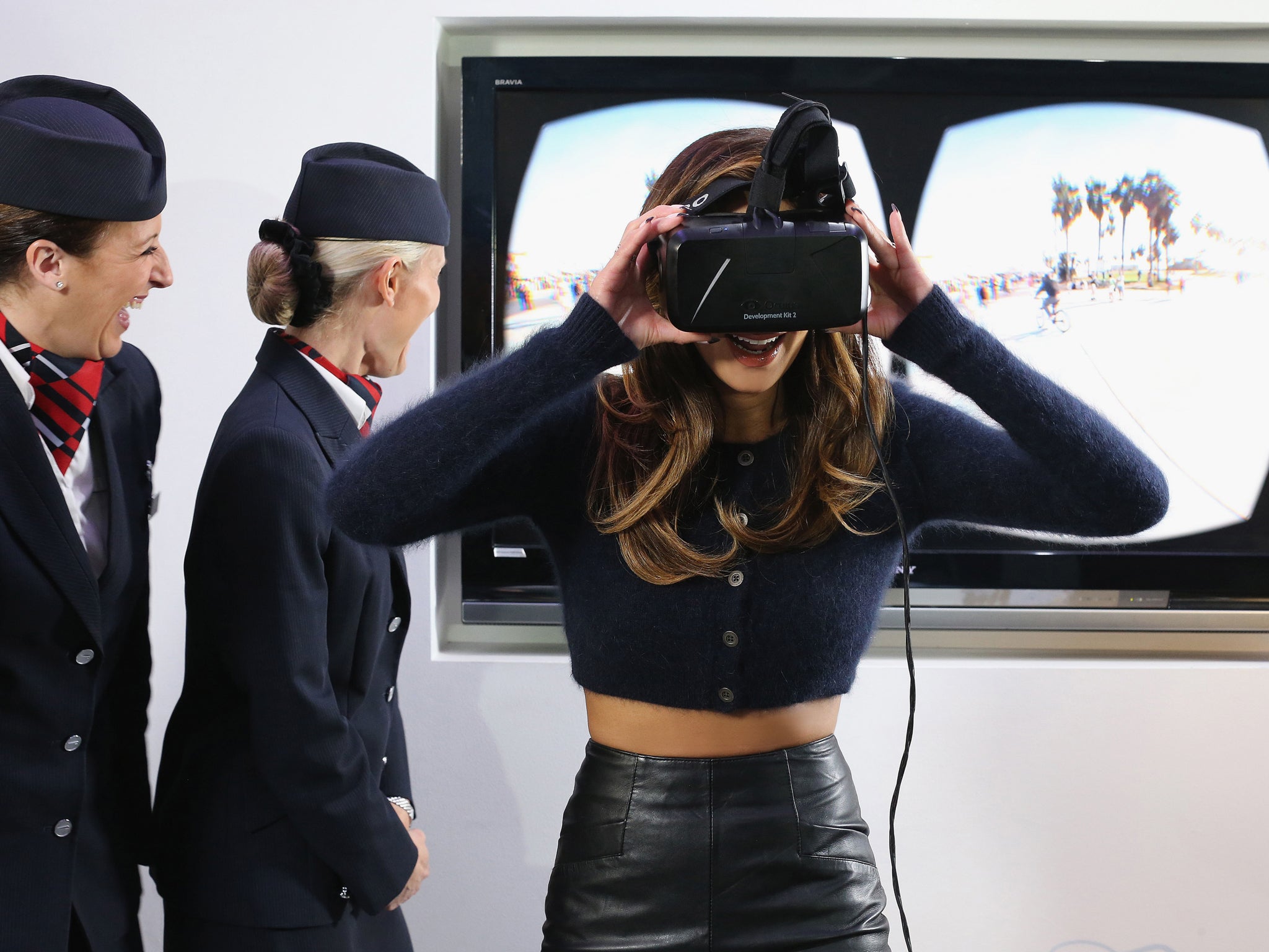 In this handout image provided by British Airways, Nicole Scherzinger tries on an Oculus Rift headset, that British Airways will use as a virtual reality technology to bring to life some of the most iconic US destinations for European customers