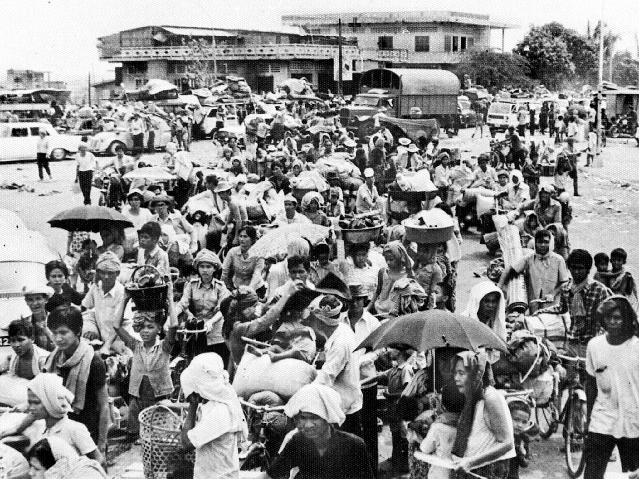 Driven from the city: families flee Phnom Penh after Khmer Rouge forces seize the Cambodian capital in April 1975