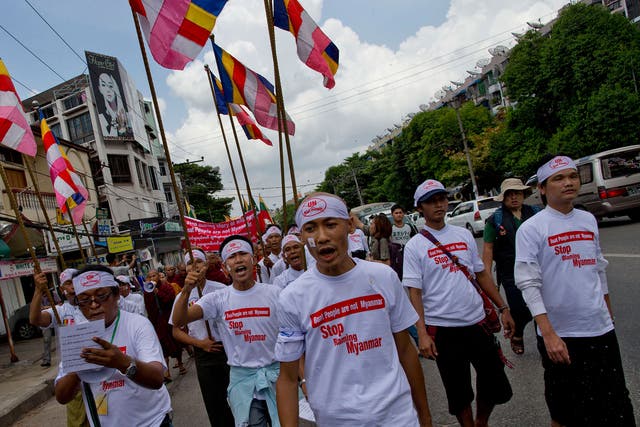 Buddhist nationalists shout slogans during a rally in Rangoon, Burma. Protesters, led by Buddhist monks, claim the boat people are from Bangladesh rather than Rohingya Muslims