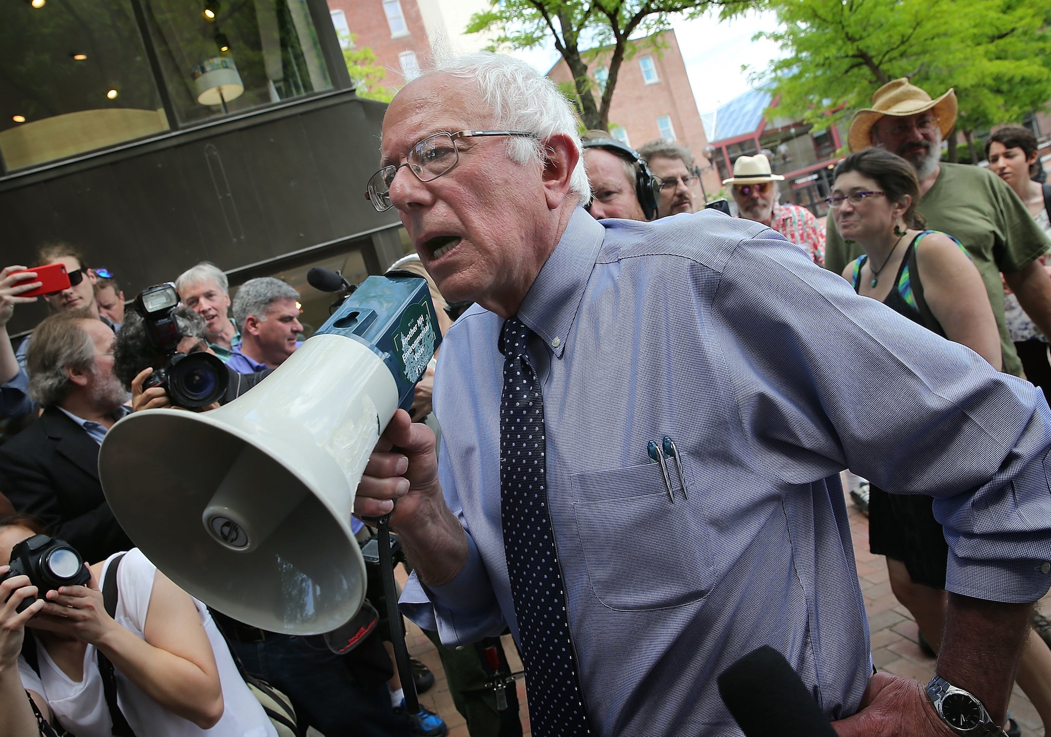 Democratic presidential candidate Bernie Sanders speaks to a crowd through megaphone after a campaign event at New England College on 27 May 2015 in Concord, New Hampshire.