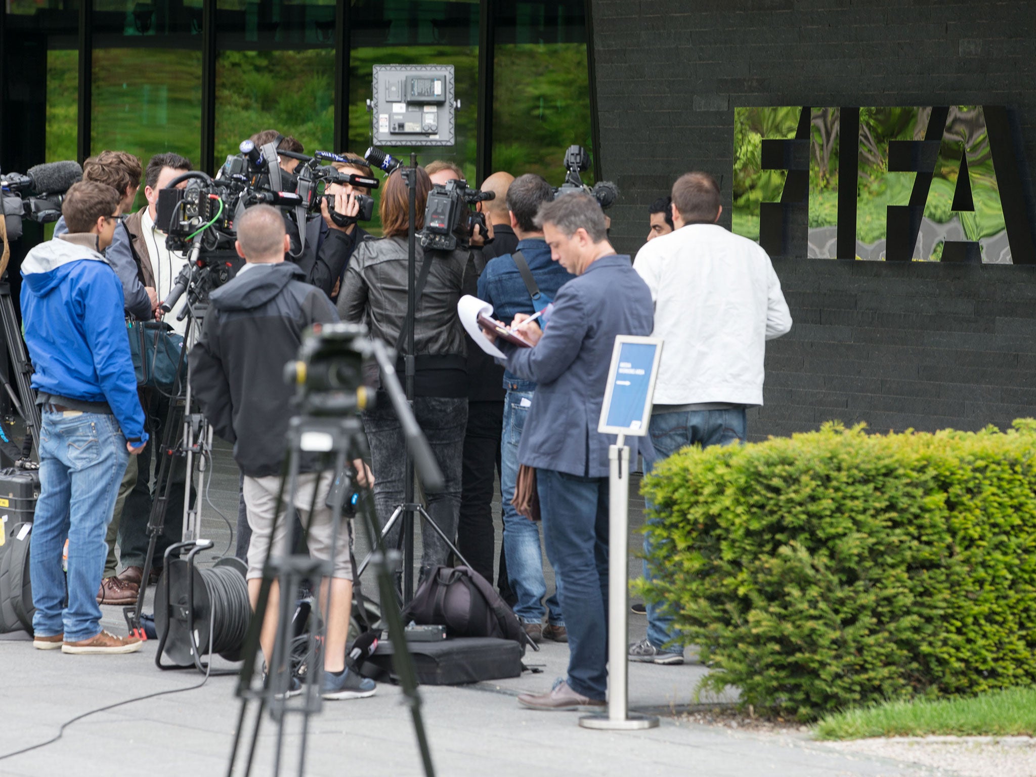 Media gather outside the headquarters of Fifa in Zurich