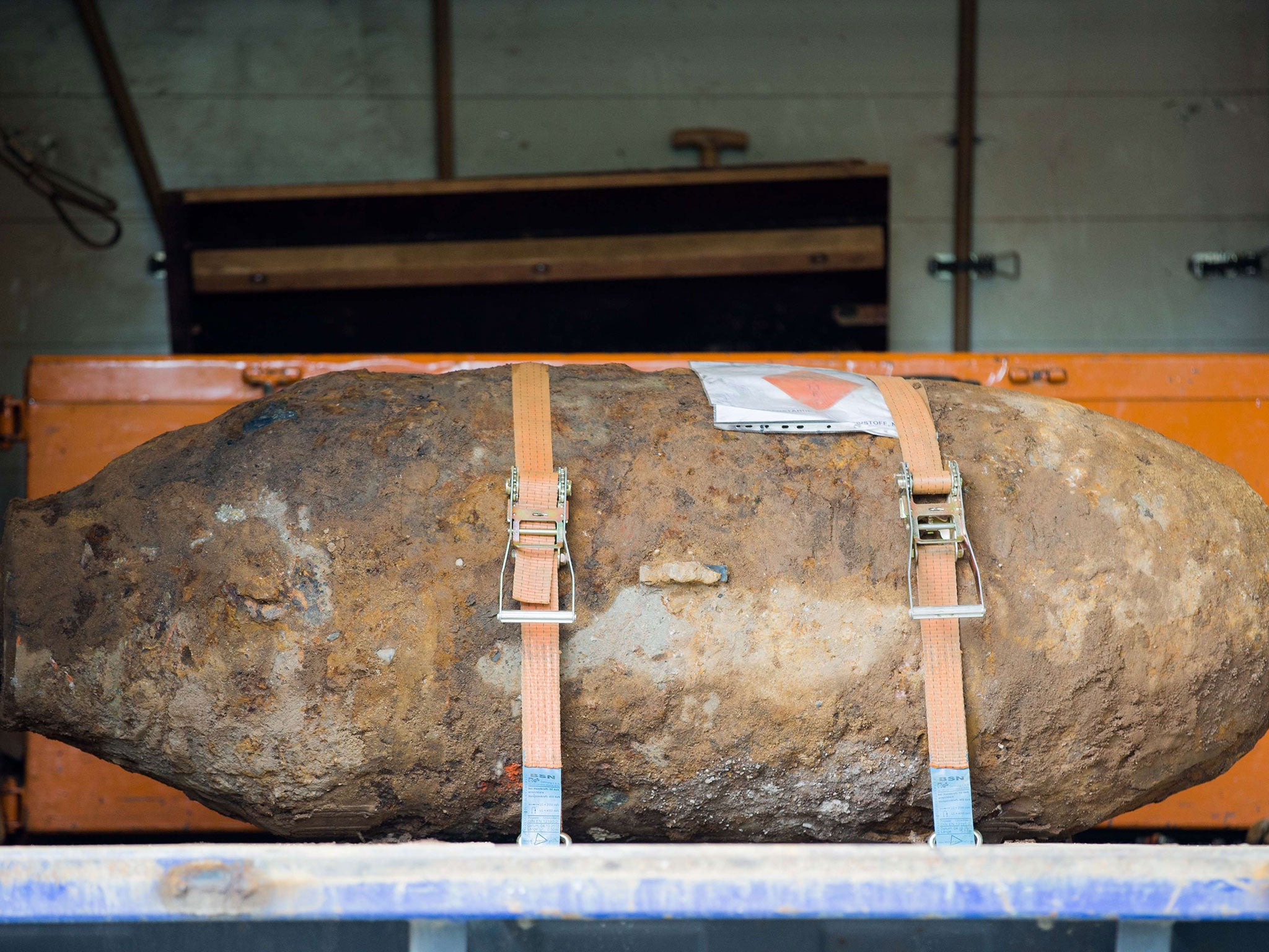 A disarmed World War II bomb on the platform of a truck near Muehlheim Bridge in Cologne, Western Germany. German authorities evacuated around 20,000 people from their homes in the western city of Cologne untill the bomb was disarmed