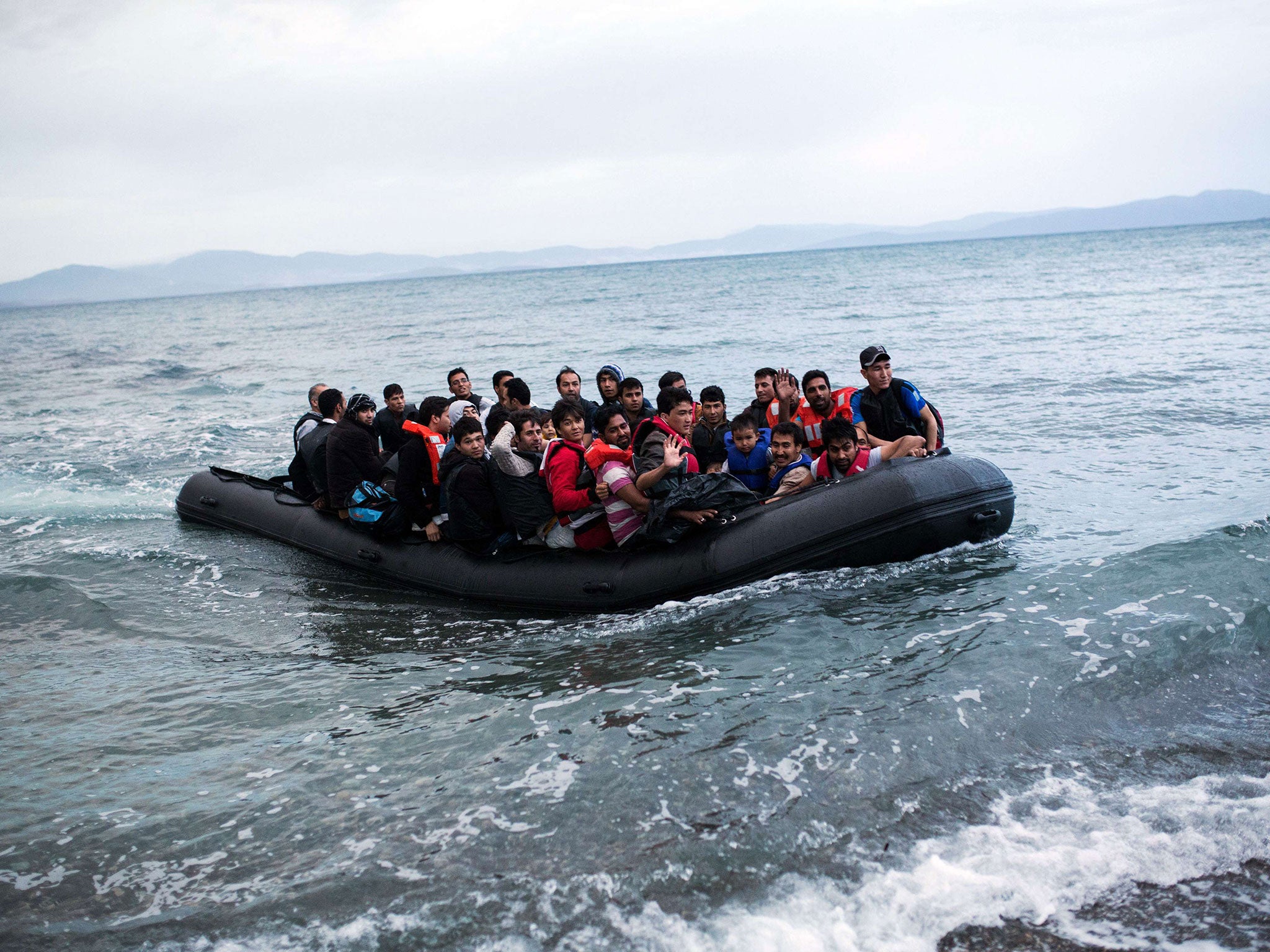 A dinghy overcrowded with Afghan immigrants arrived on a beach on the Greek island of Kos