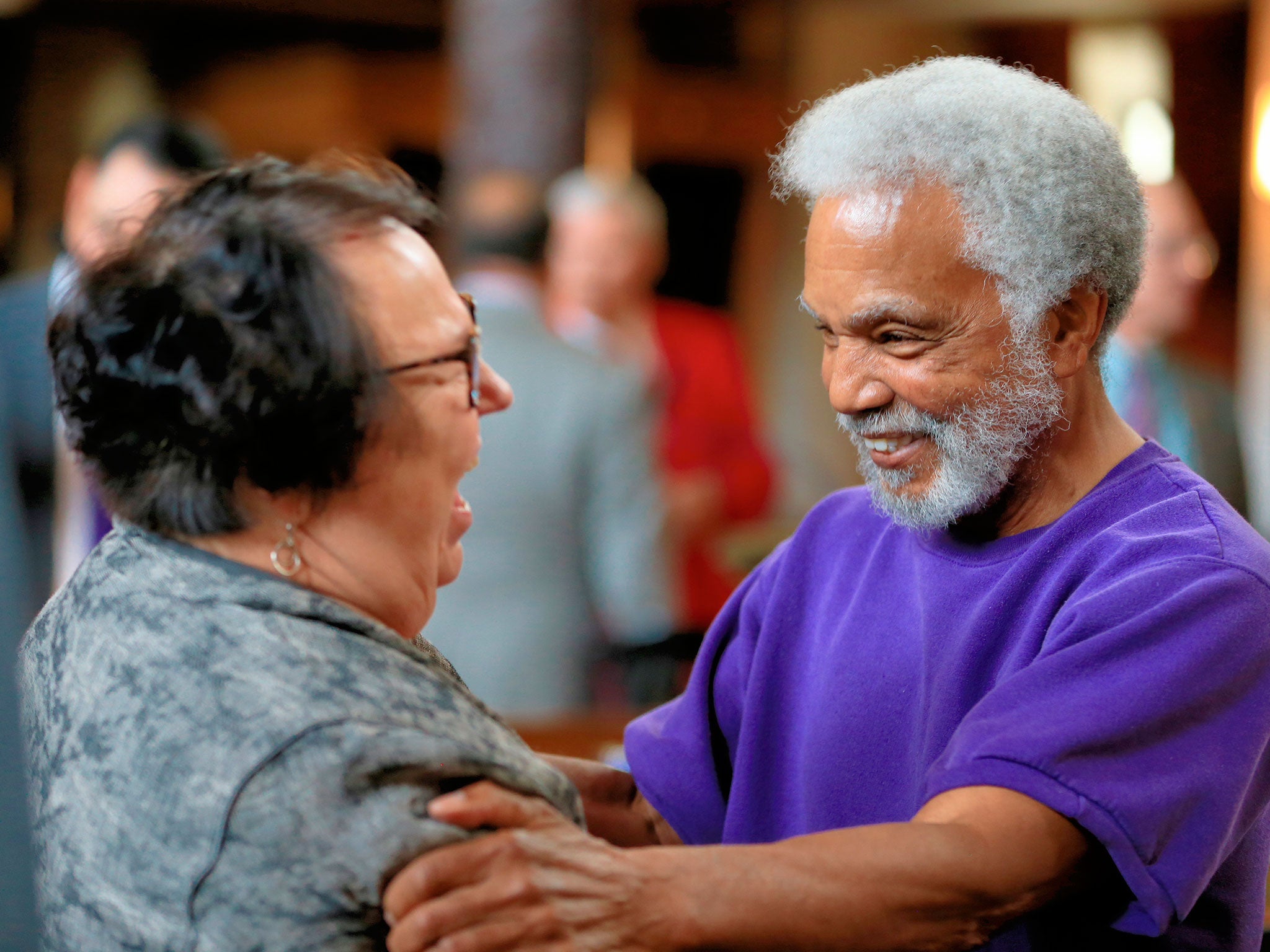 Senator Ernie Chambers, right , who introduced the repeal measure, celebrates the vote with Senator Kathy Campbell