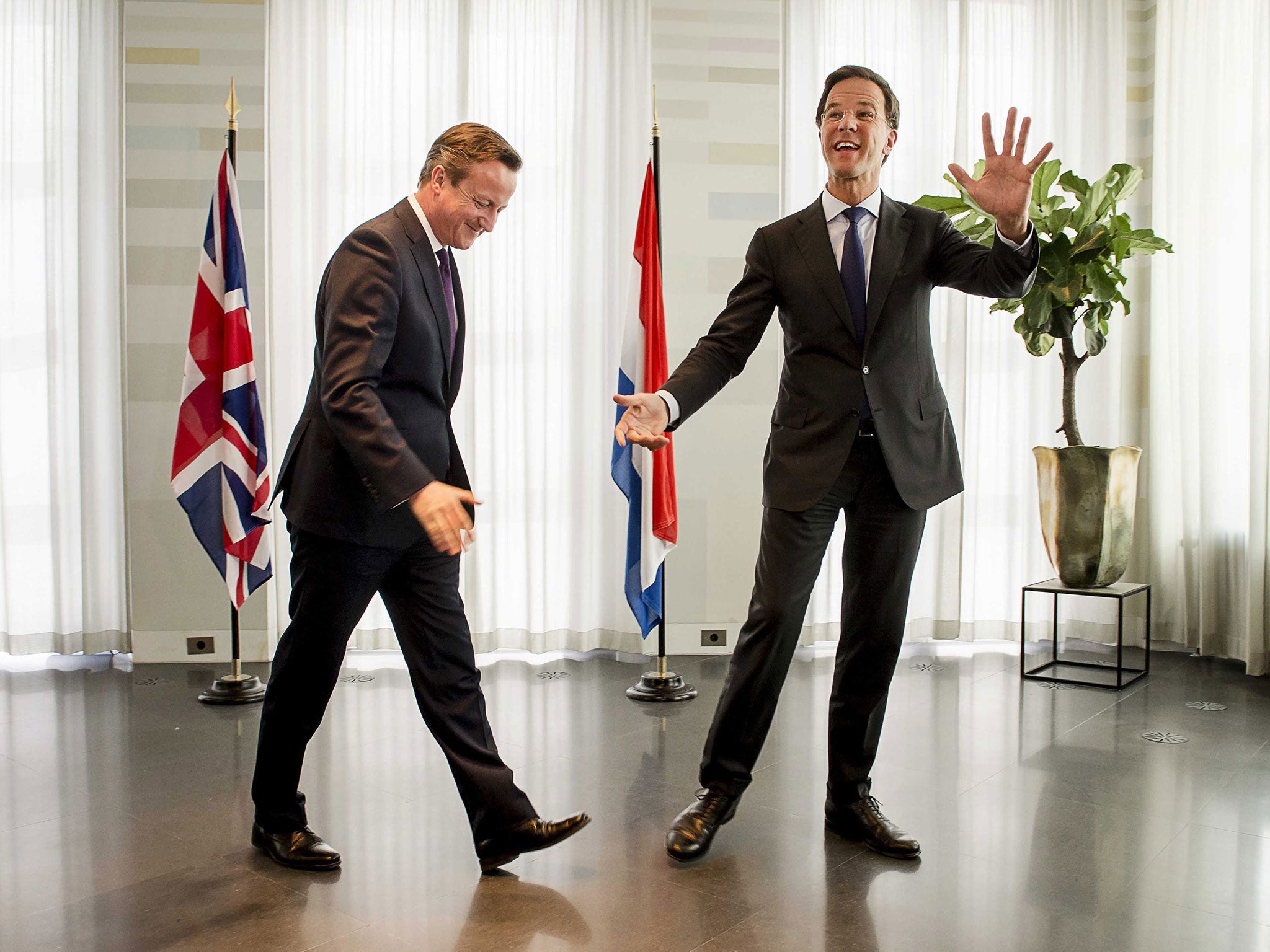 Mark Rutte, right, the Prime Minister of The Netherlands, welcomes David Cameron to The Hague