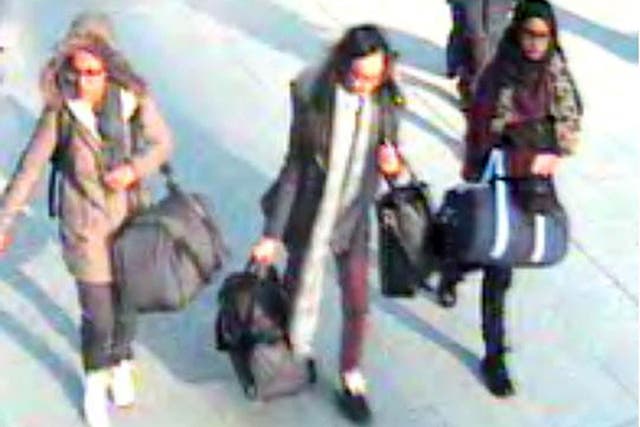 CCTV still of 15-year-old Amira Abase, left, Kadiza Sultana,16, center, and Shamima Begum, 15, walk through Gatwick airport, south of London, before catching their flight to Turkey. The three teenage girls left the country in a suspected bid to travel to Syria to join the Islamic State extremist group