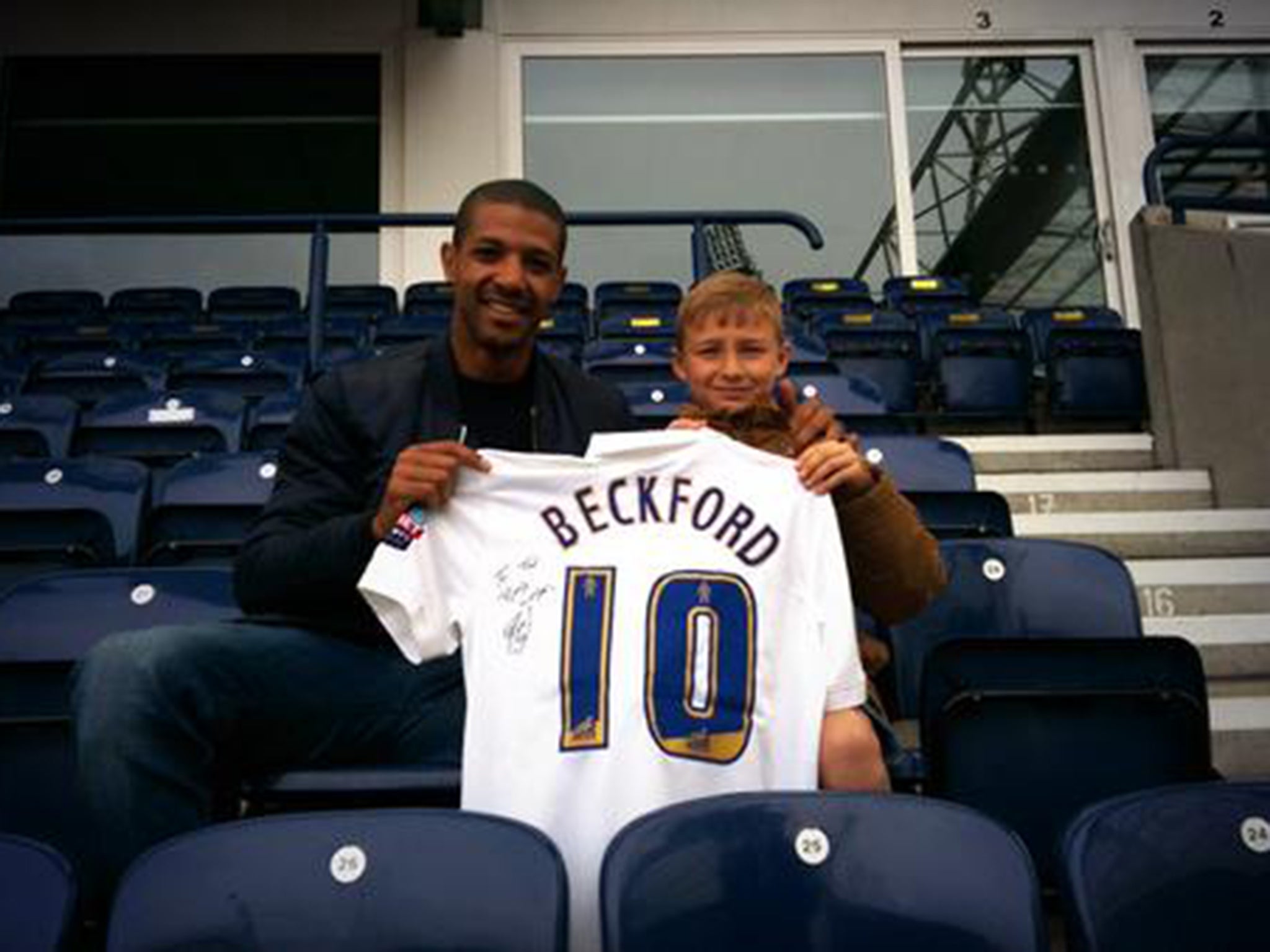 Jermaine Beckford presents Ted Dockray with his signed shirt