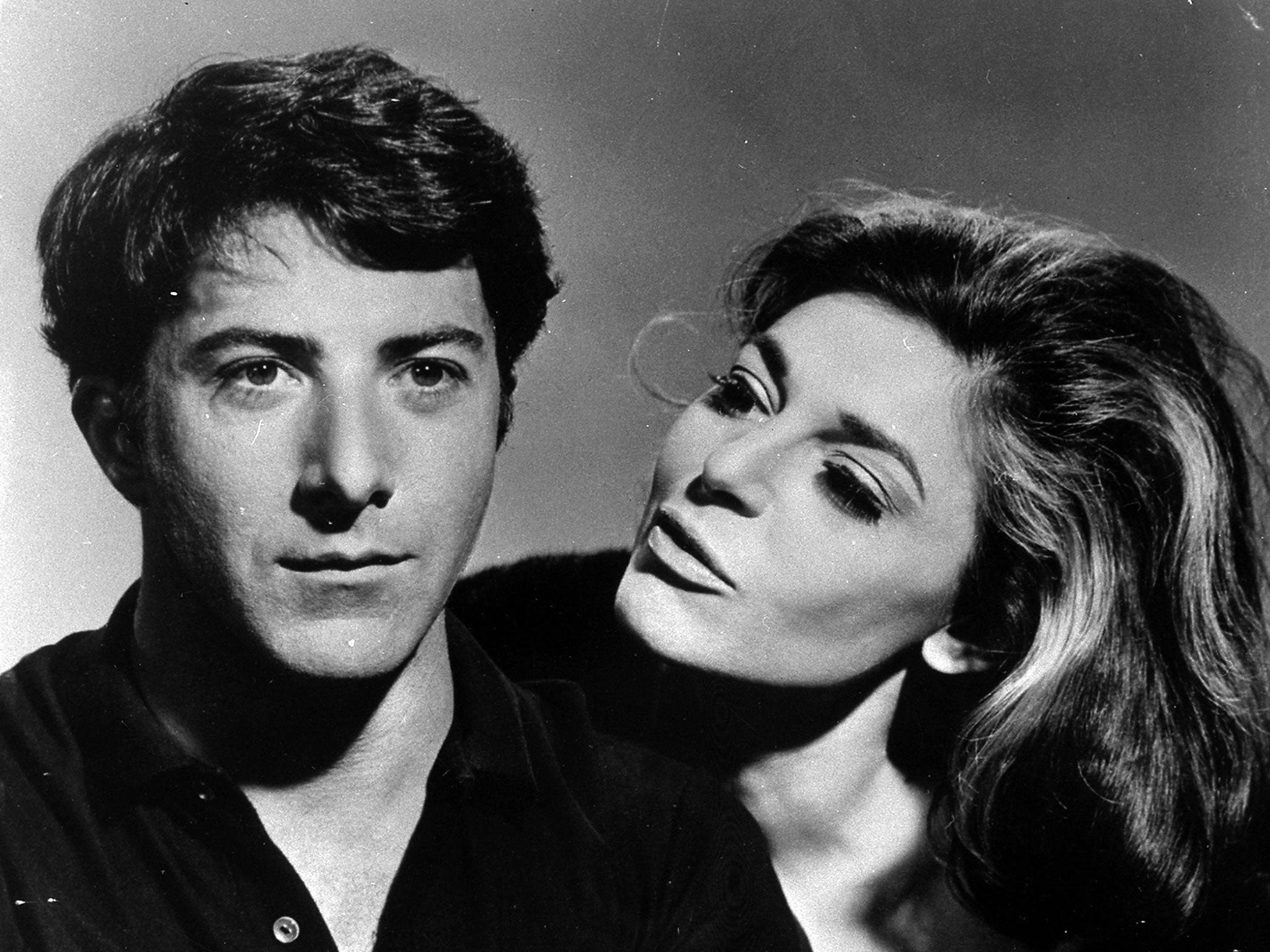 Actress Anne Bancroft staring alongside actor Dustin Hoffman in the movie "The Graduate