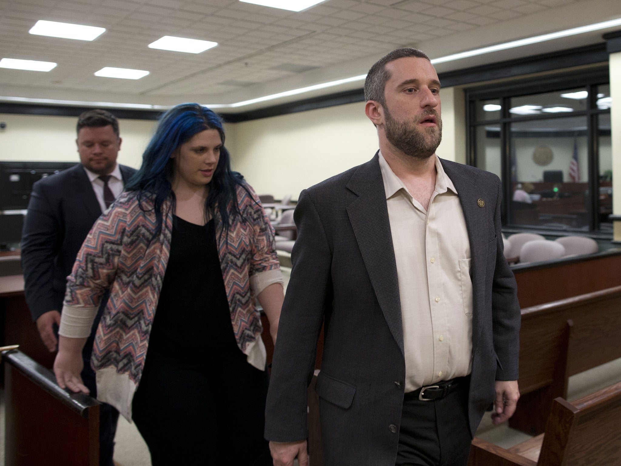 Dustin Diamond, with his fiancee Amanda Schutz and her attorney walk out of the coutroom in May