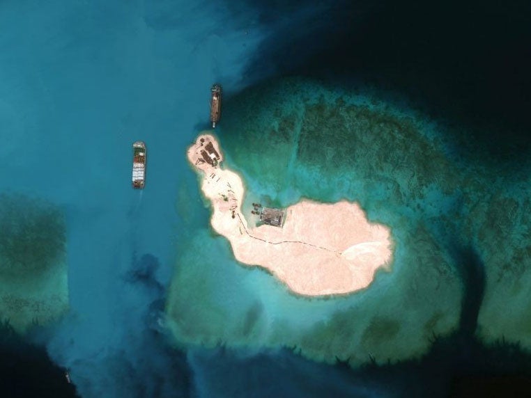 Cargo is unloaded on one of an artificially constructed island in the South China Sea