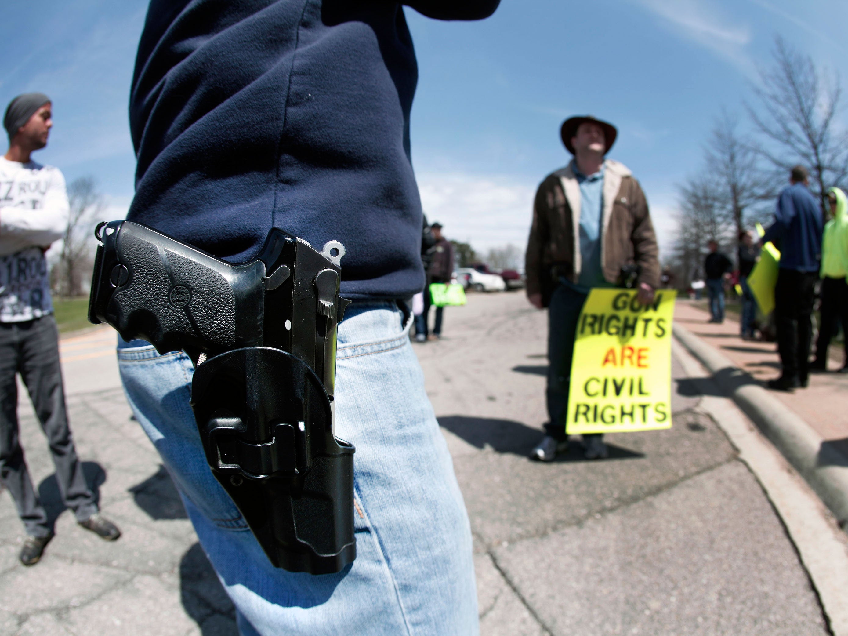 A supporter of Michigan's Open Carry law attends a rally and march April 27, 2014 in Romulus, Michigan.