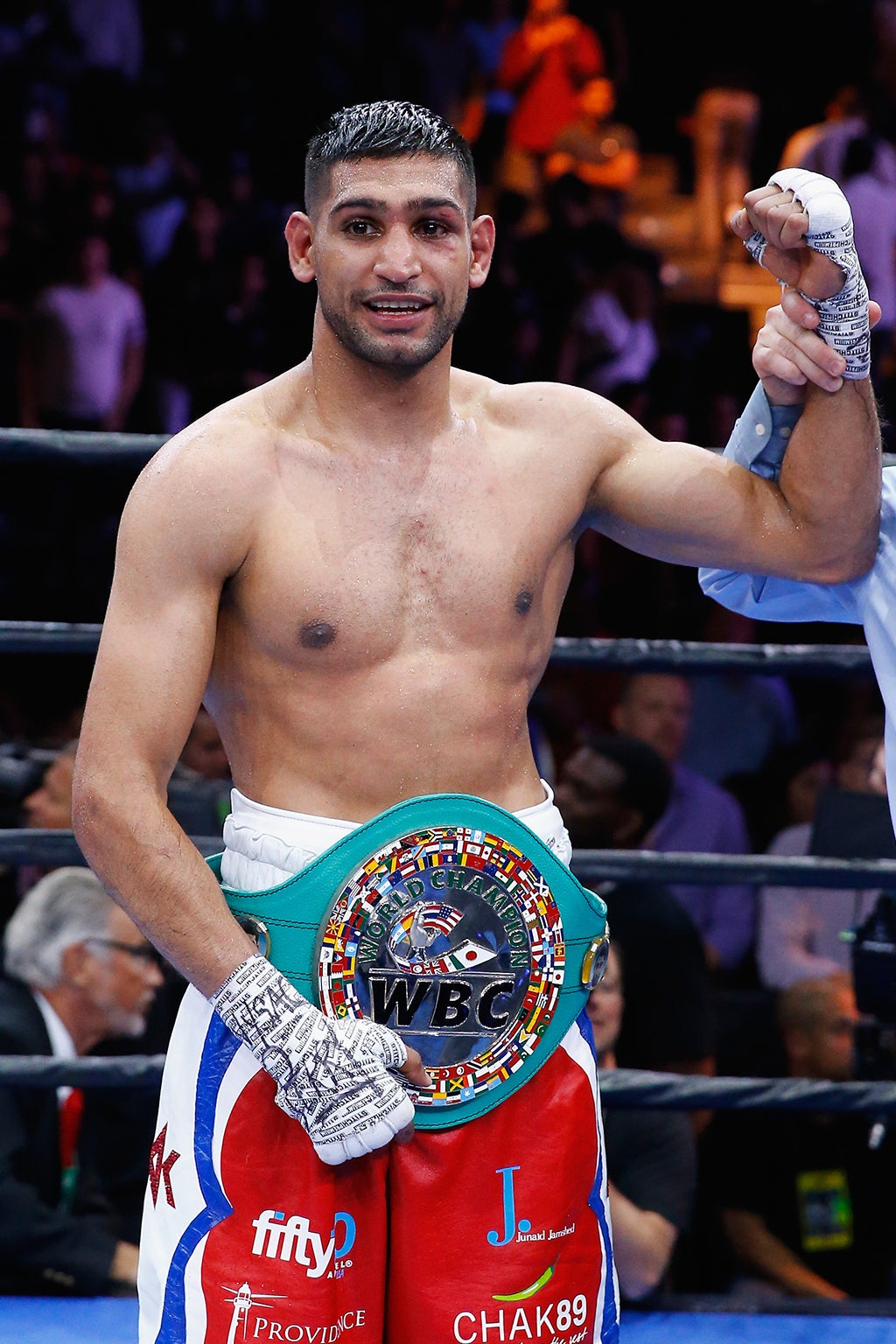 Khan celebrates victory over Algieri