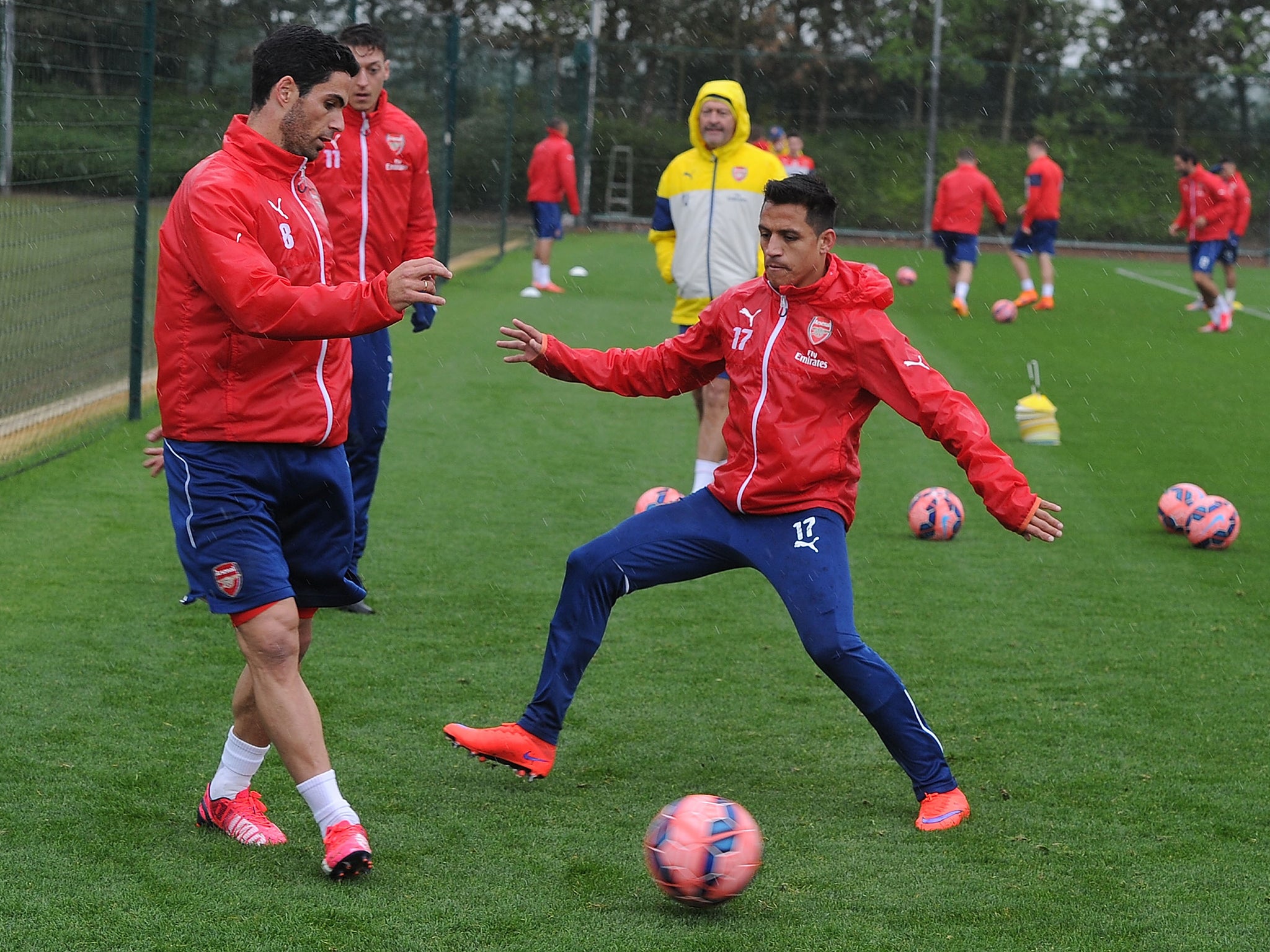 Mikel Arteta with Alexis Sanchez during training