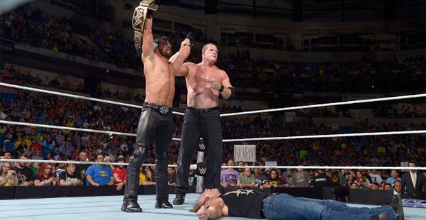 Seth Rollins and Kane stand tall over a motionless Dean Ambrose