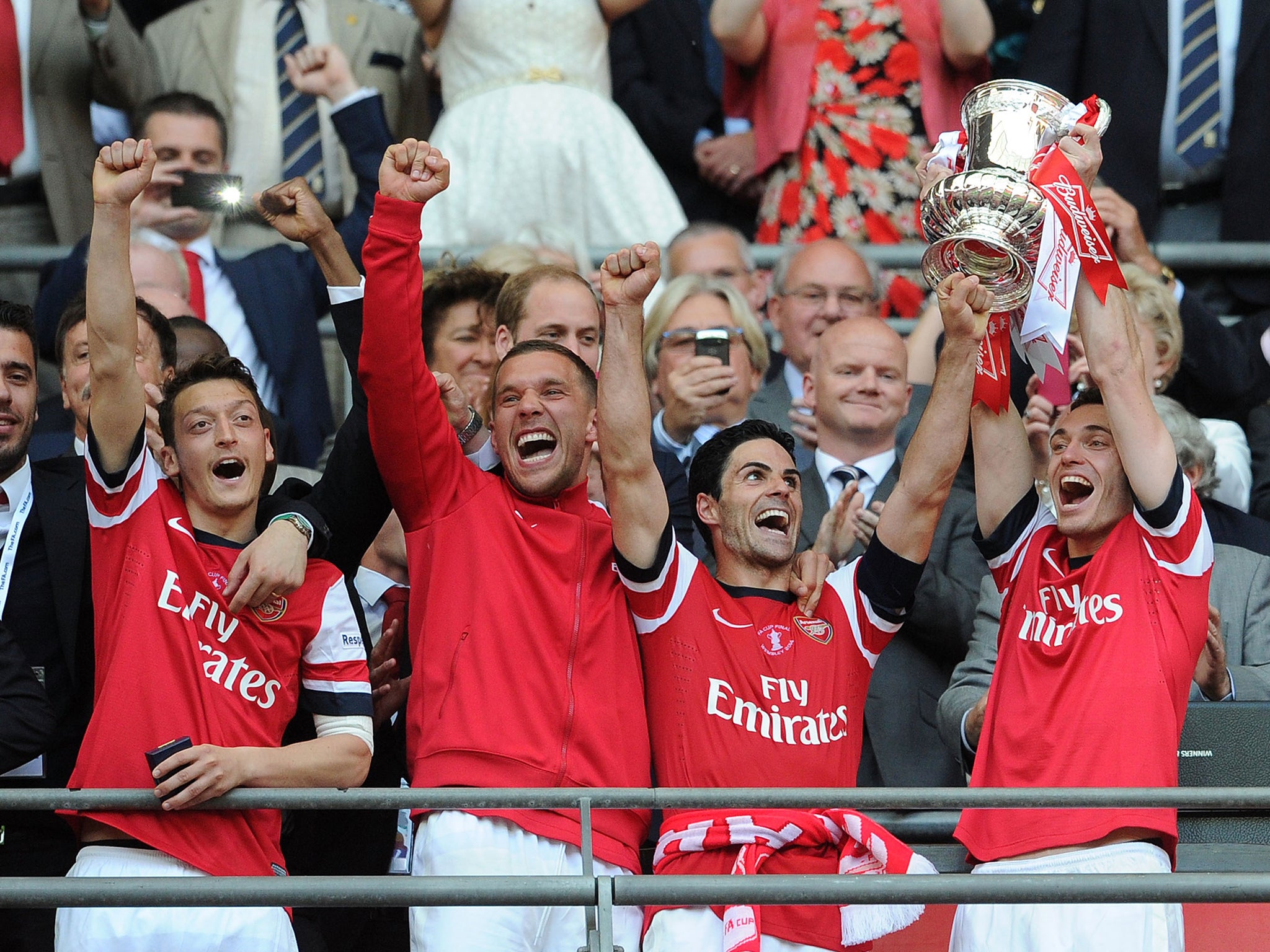 Thomas Vermaelen lifts the FA Cup trophy last season