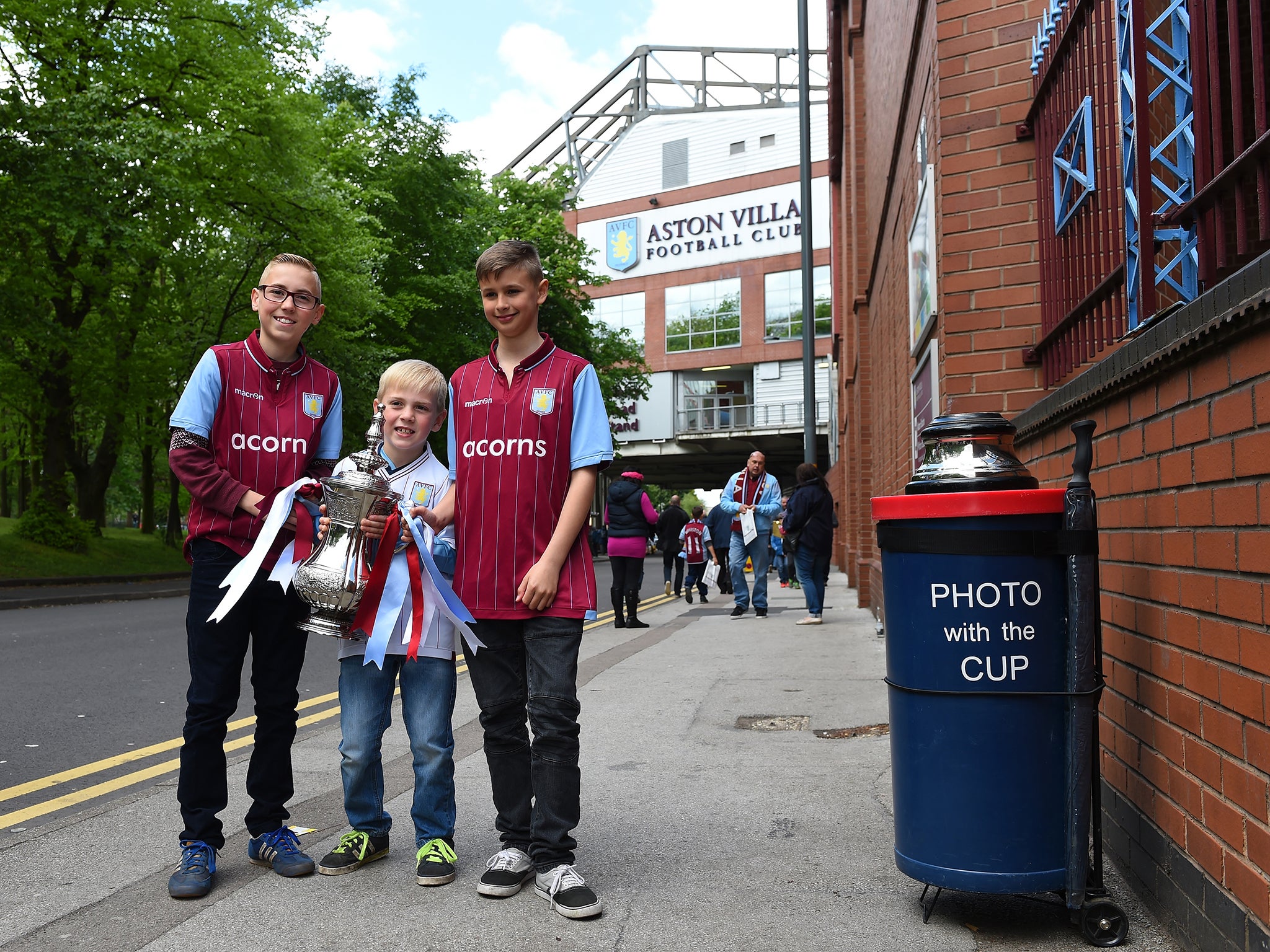 Aston Villa fans have pictures taken with a replica FA Cup trophy