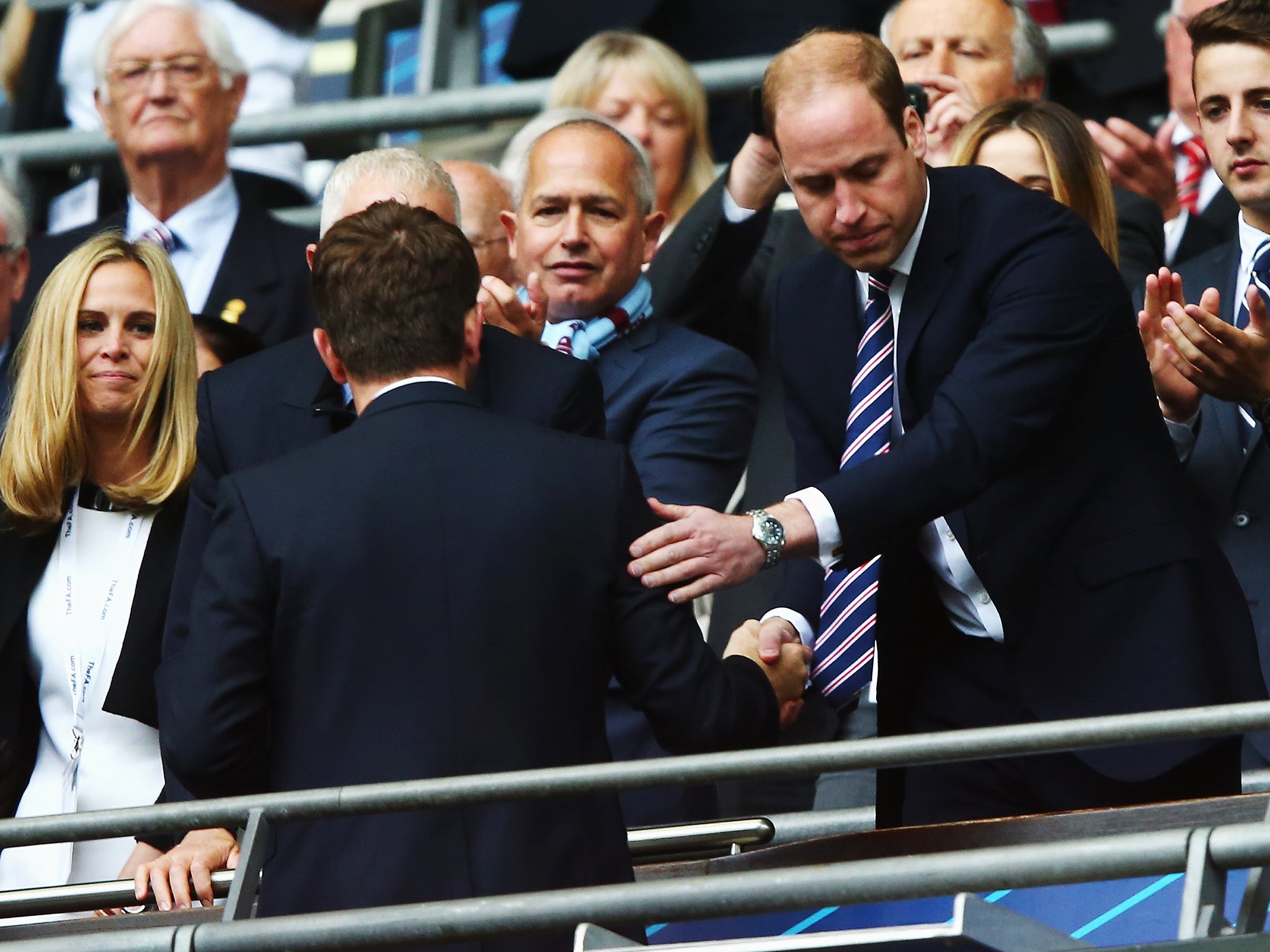 Prince William shakes hands with Tim Sherwood