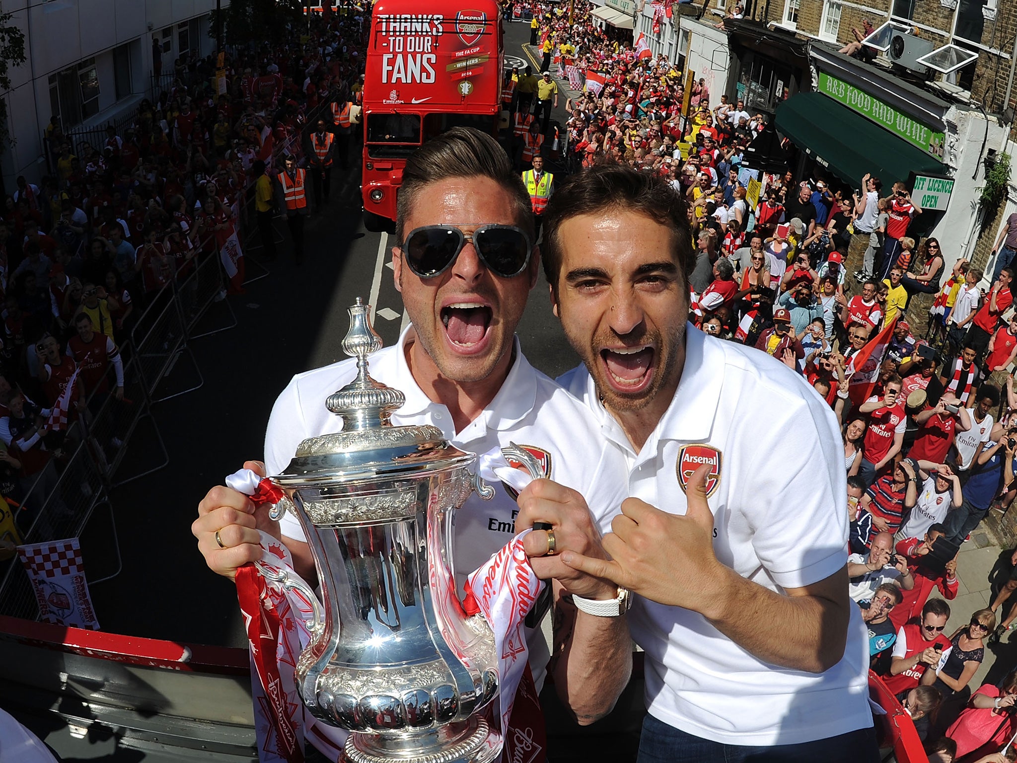Olivier Giroud and Mathieu Flamini celebrate Arsenal's 2014 FA Cup victory