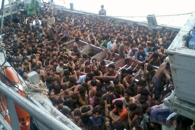 Migrants who were seized by the Myanmar navy in a boat near Irrawaddy delta of the Myanmar's southern coast.