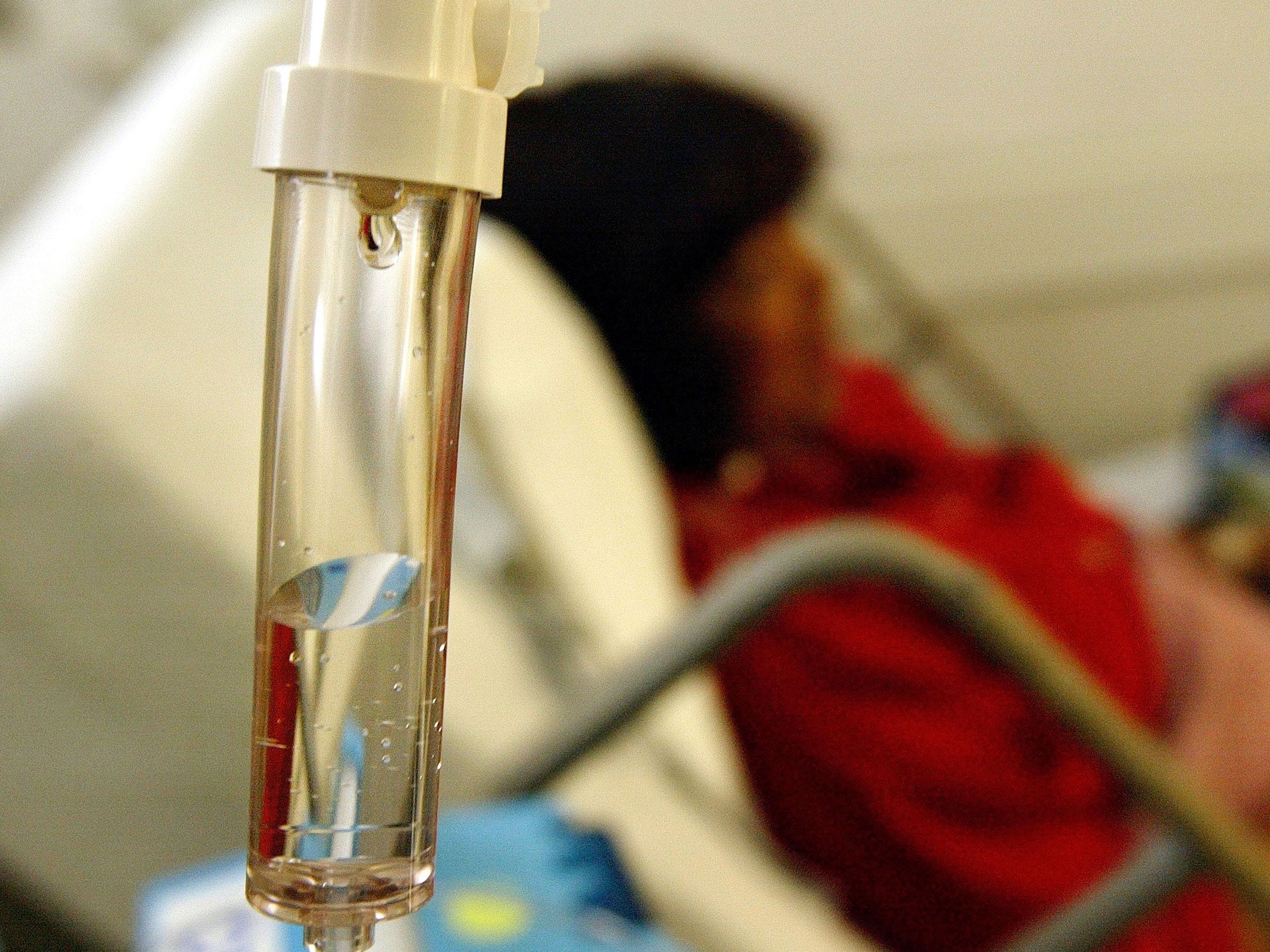A woman receives chemotherapy treatment for cancer