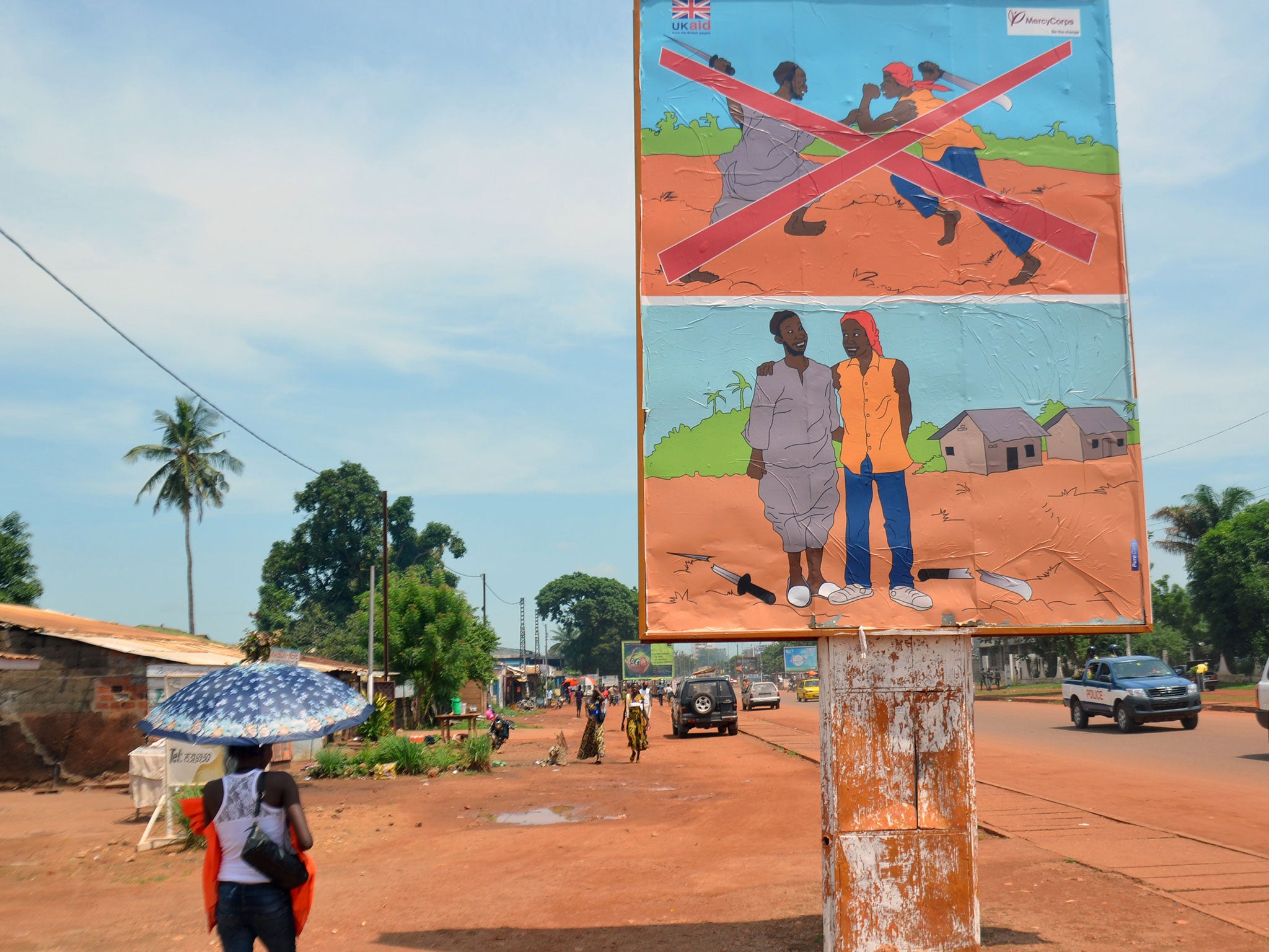 A sign at the entrance to the KM5 market in Bangui. A nearby banner implores ‘Let Us Reconcile’