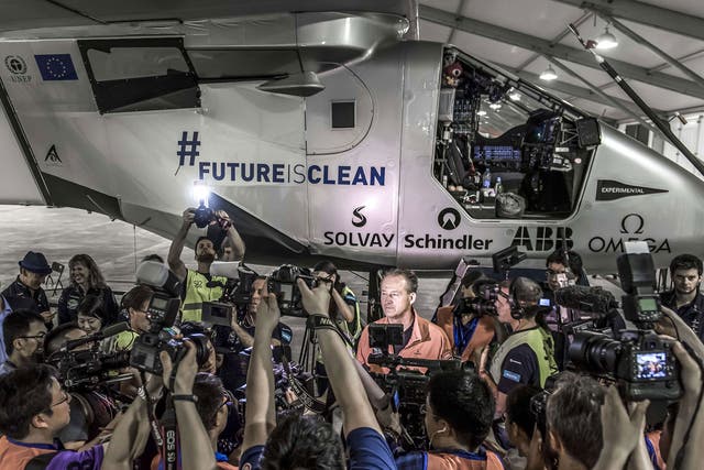 Swiss pilot Andre Borschberg speaks before ‘Solar Impulse 2’ takes off from Nanjing, China