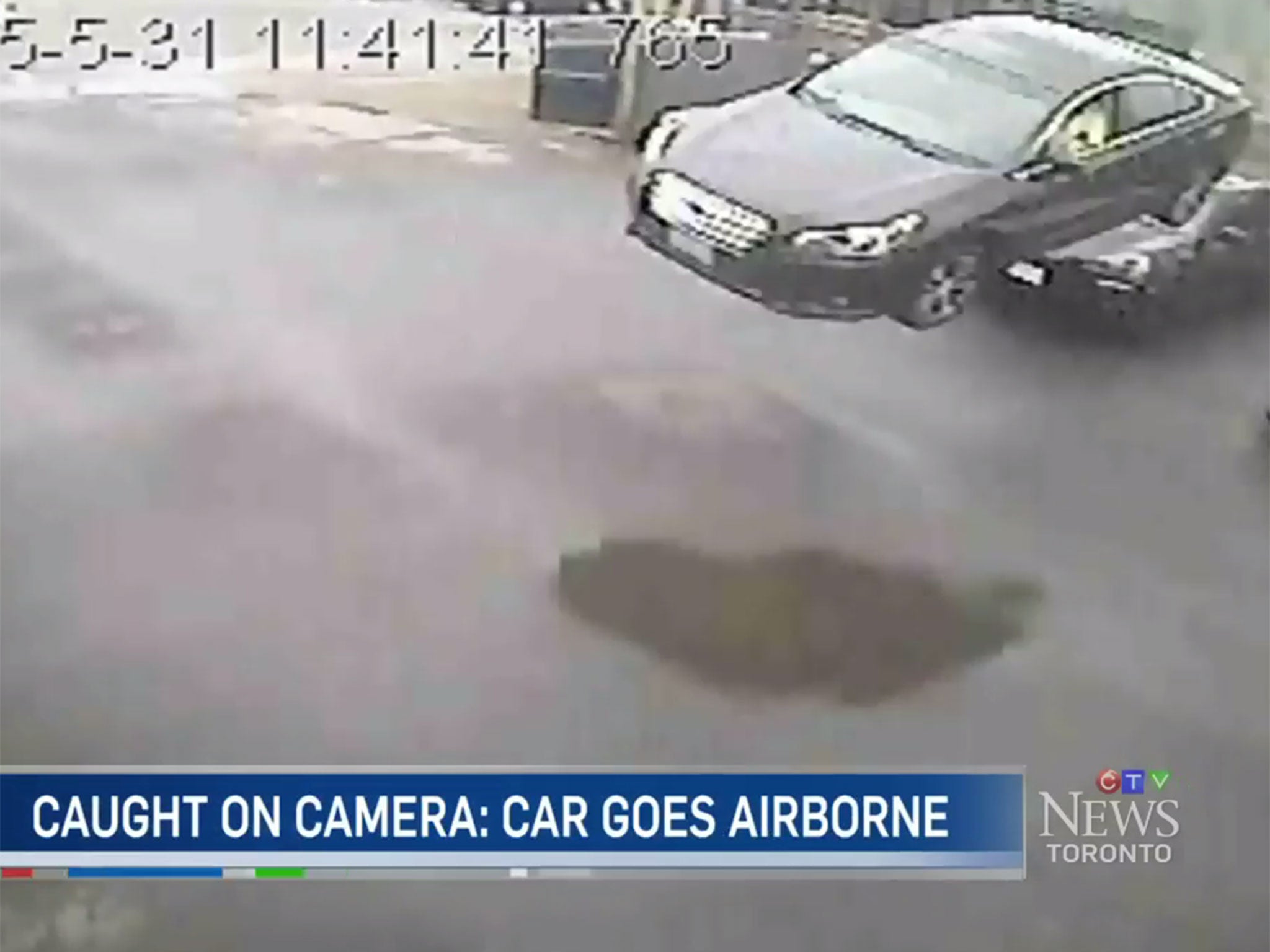 A dramatic car crash in Toronto, Canada, has been caught on CCTV camera