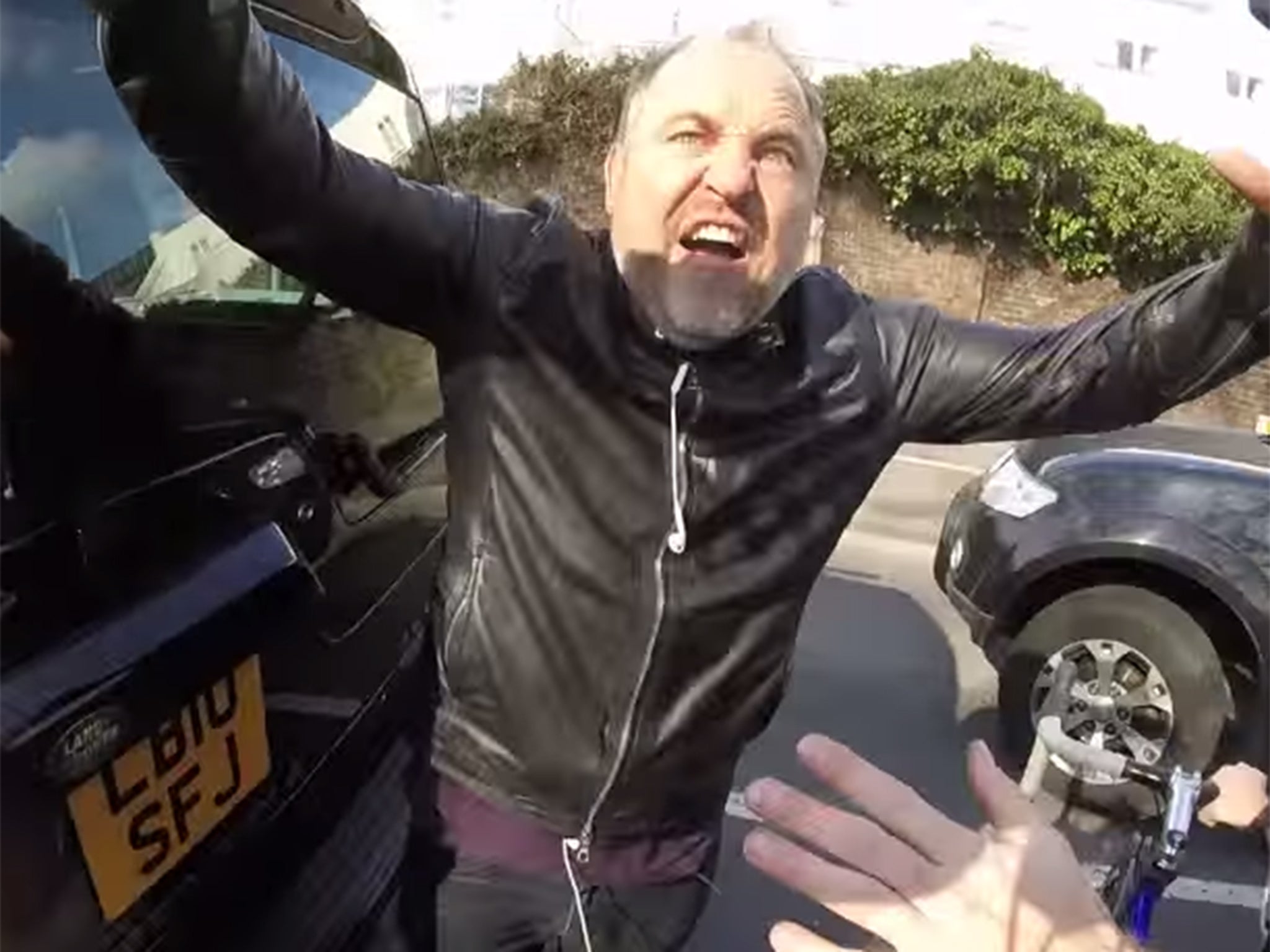 The angriest driver in Britain does his best bear impression.