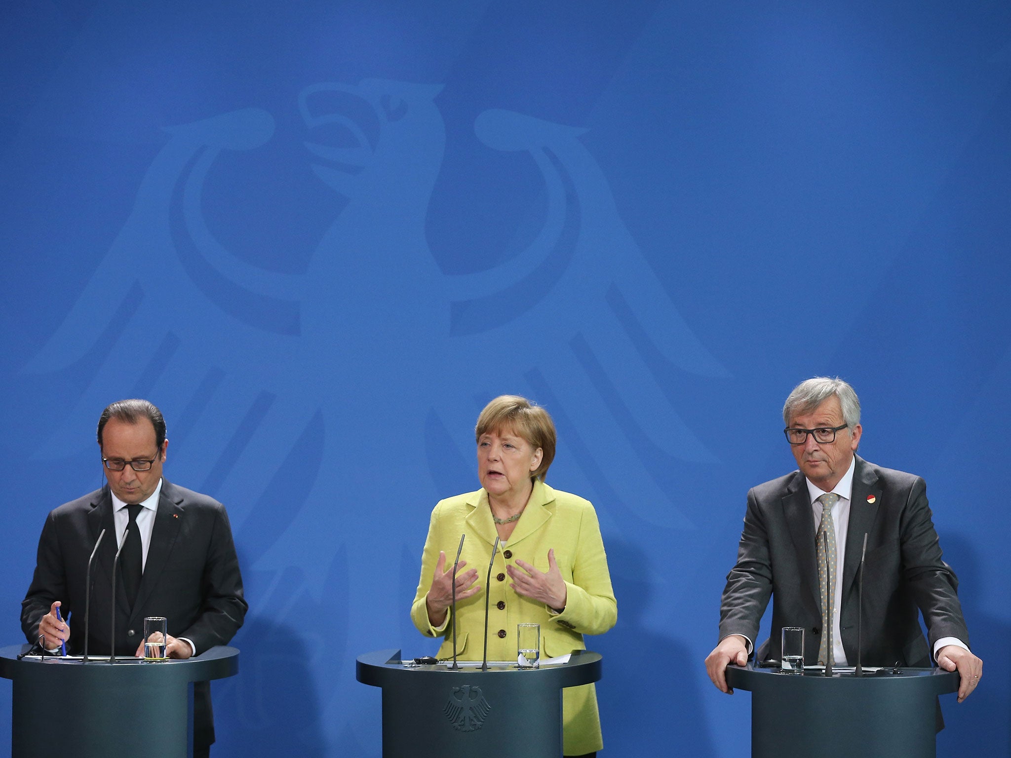 German Chancellor Angela Merkel, French President François Hollande, left, and Mr Juncker met in Berlin