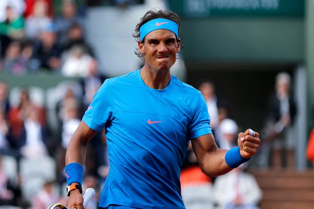 Rafael Nadal celebrates after winning a point on his way to victory against Jack Sock