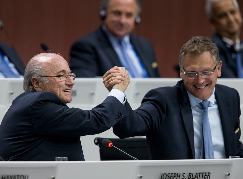Fifa president Sepp Blatter shakes hands with Jerome Valcke