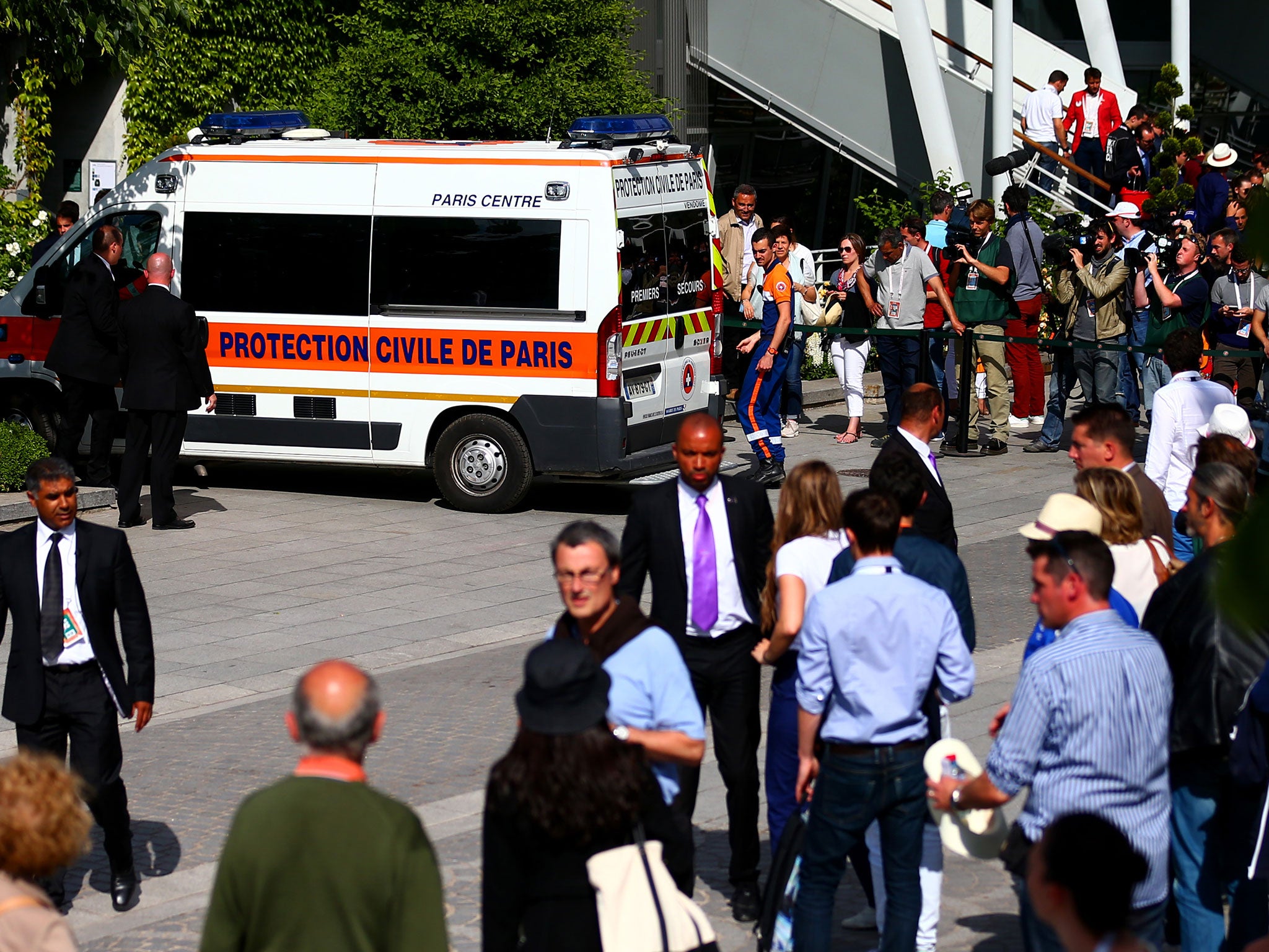 An ambulance transports an injured spectator