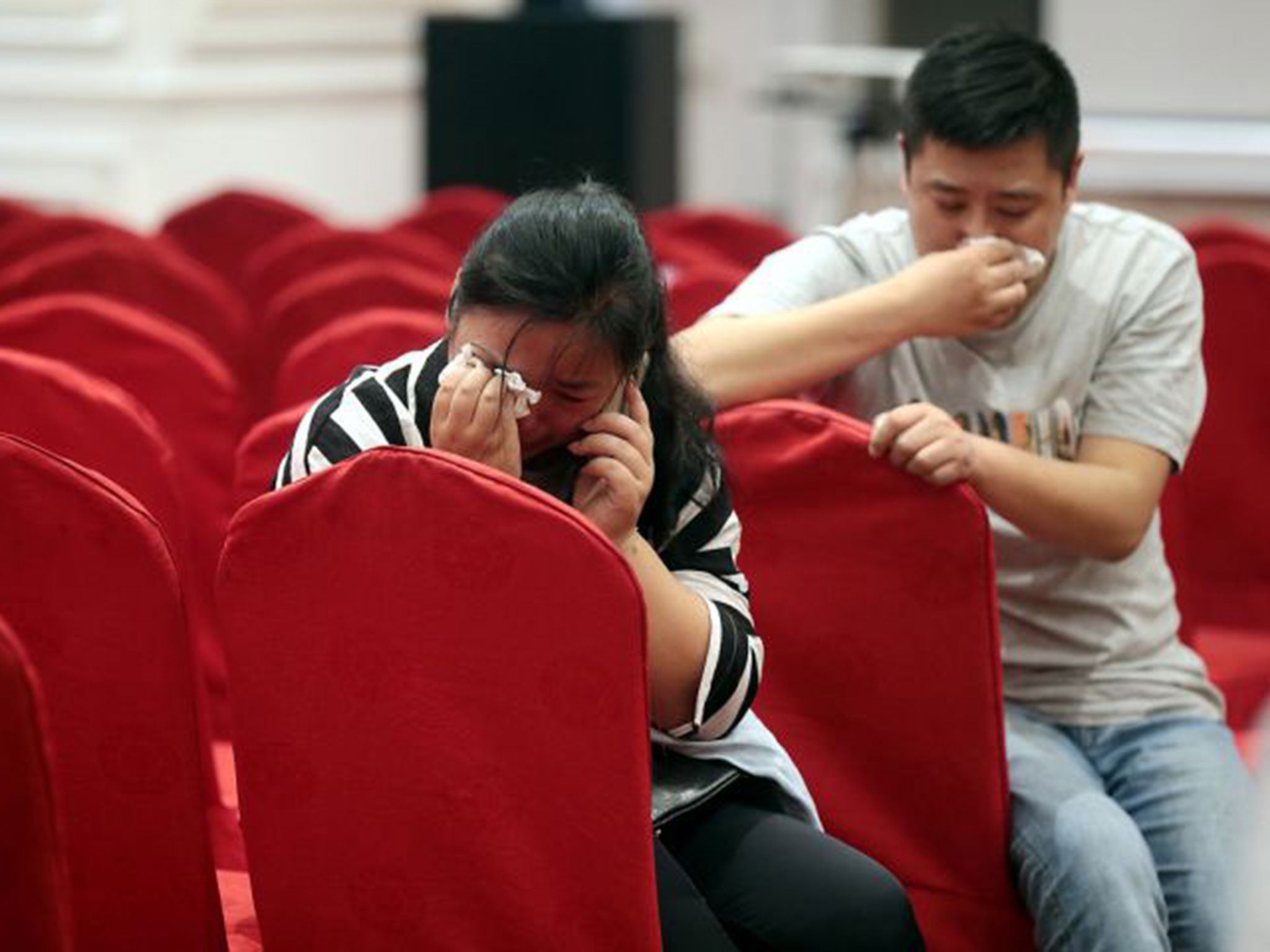 Relatives of passengers on the capsized ship Dongfangzhixing wait for news