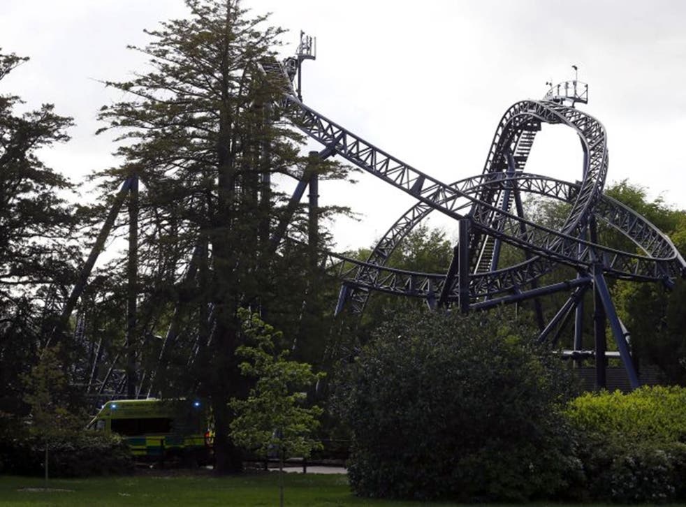 An ambulance drives past the Smiler ride at Alton Towers in Alton, Britain June 2, 2015. Four teenagers were seriously hurt at one of Britain's biggest theme parks on Tuesday when two carriages collided on a rollercoaster ride, rescue workers said.  