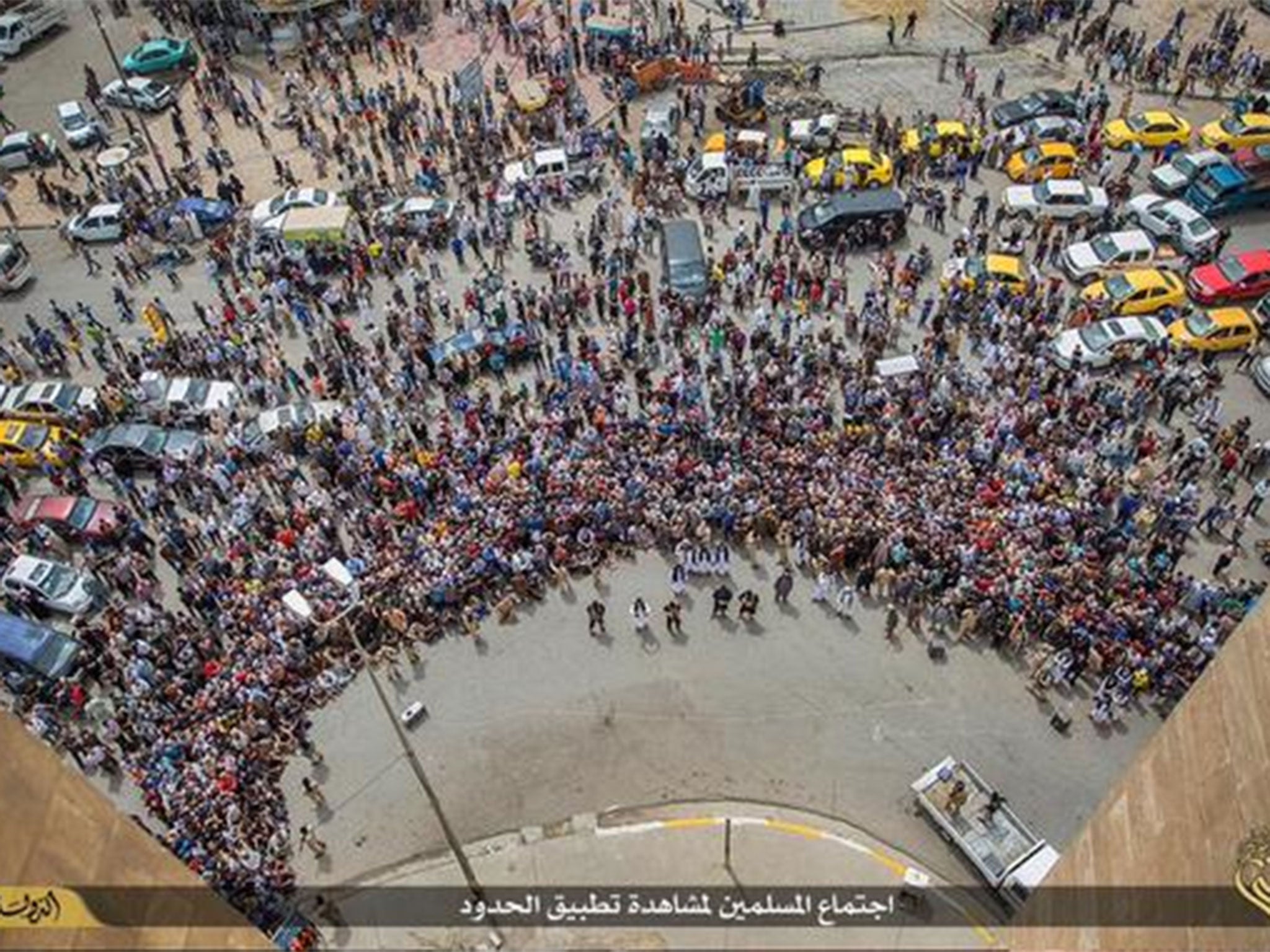 Isis released images showing a large crowd, reportedly armed with stones, watching the executions