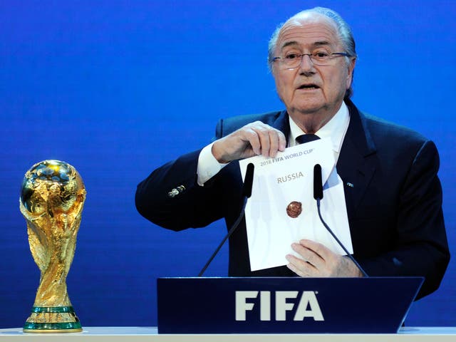 Sepp Blatter holds up the name of Russia during the official announcement of the 2018 World Cup host country on December 2, 2010