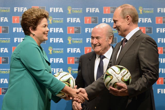 Russian President Vladimir Putin, far right, with the Fifa President Sepp Blatter, centre, and Brazilian President Dilma Rousseff after the 2014 World Cup final in Brazil
