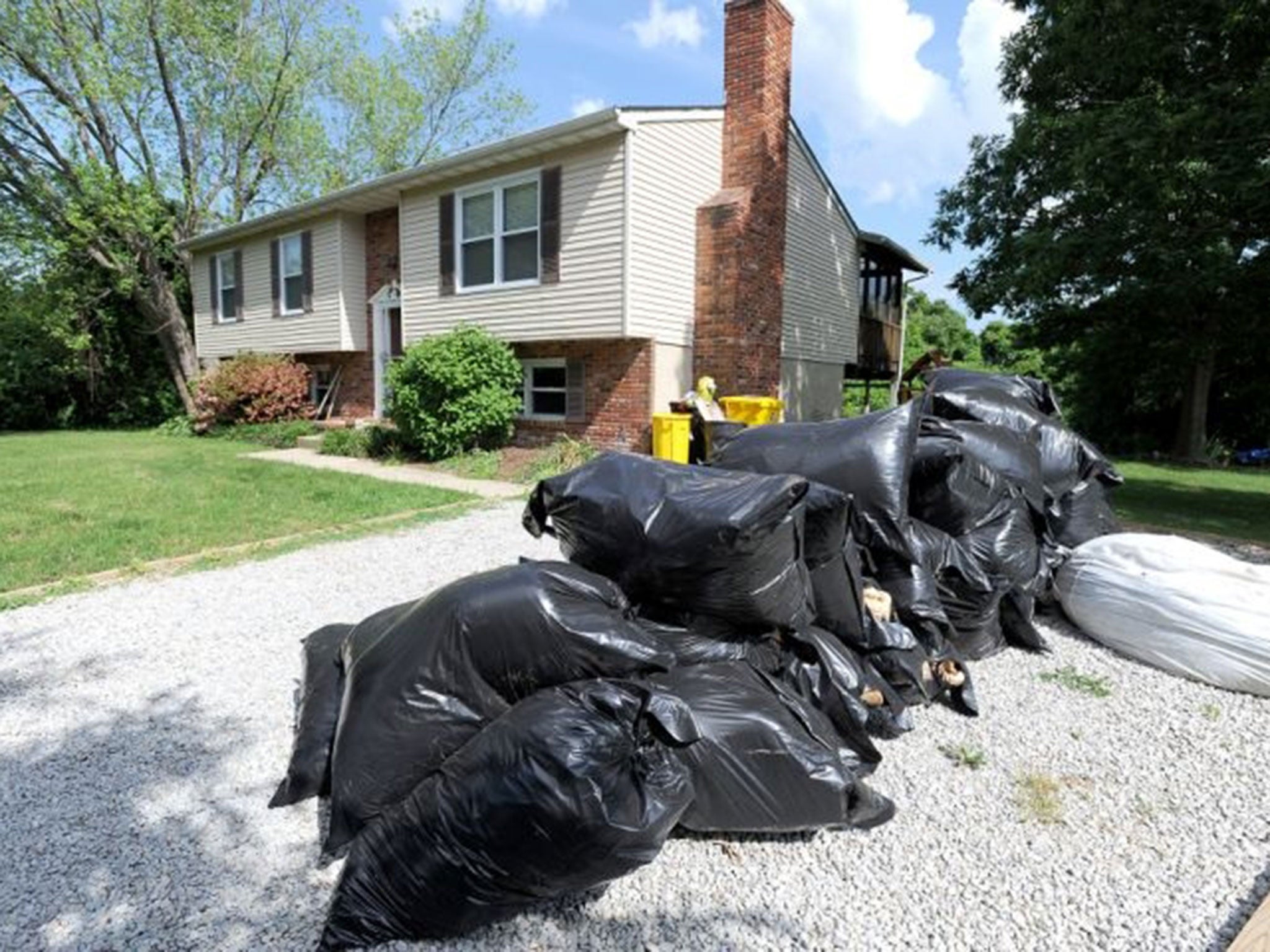 Bags of insulation removed from the snake-infested home. (Paul W. Gillespie/AP)