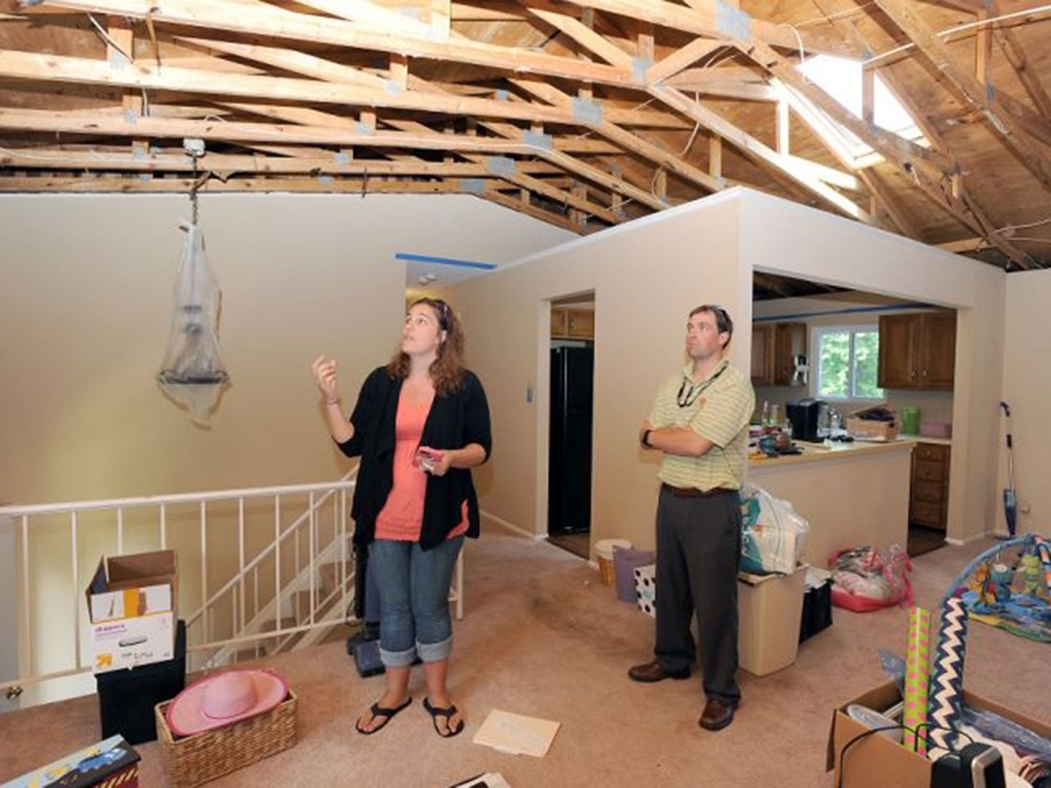 Jody and Jeff Brooks talk about their snake problem in their home. (Paul W. Gillespie/AP)