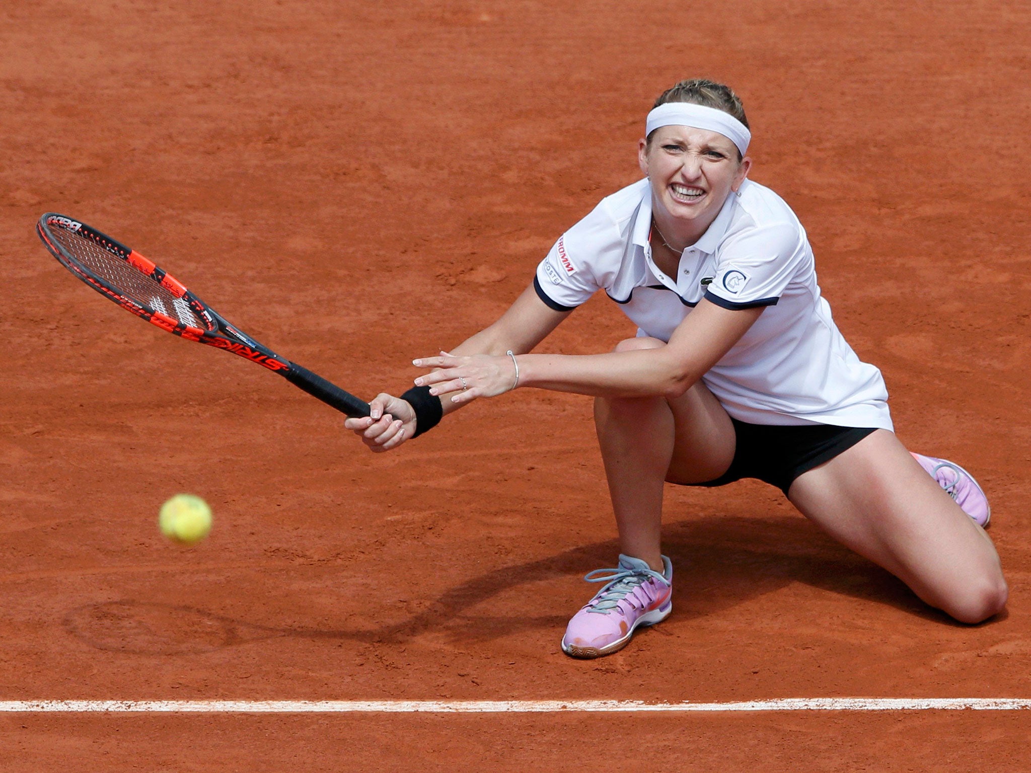 Timea Bacsinszky returns the ball during her victory over Belgium’s Alison Van Uytvanck