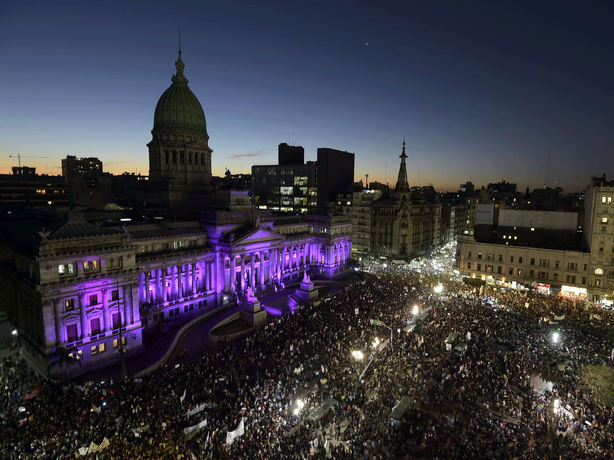 People gather in front of the Congress building to take part in the 'Ni una menos' demonstration in Buenos Aires