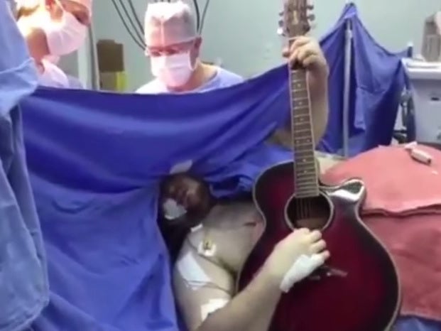 Brazilian man plays guitar while undergoing brain surgery