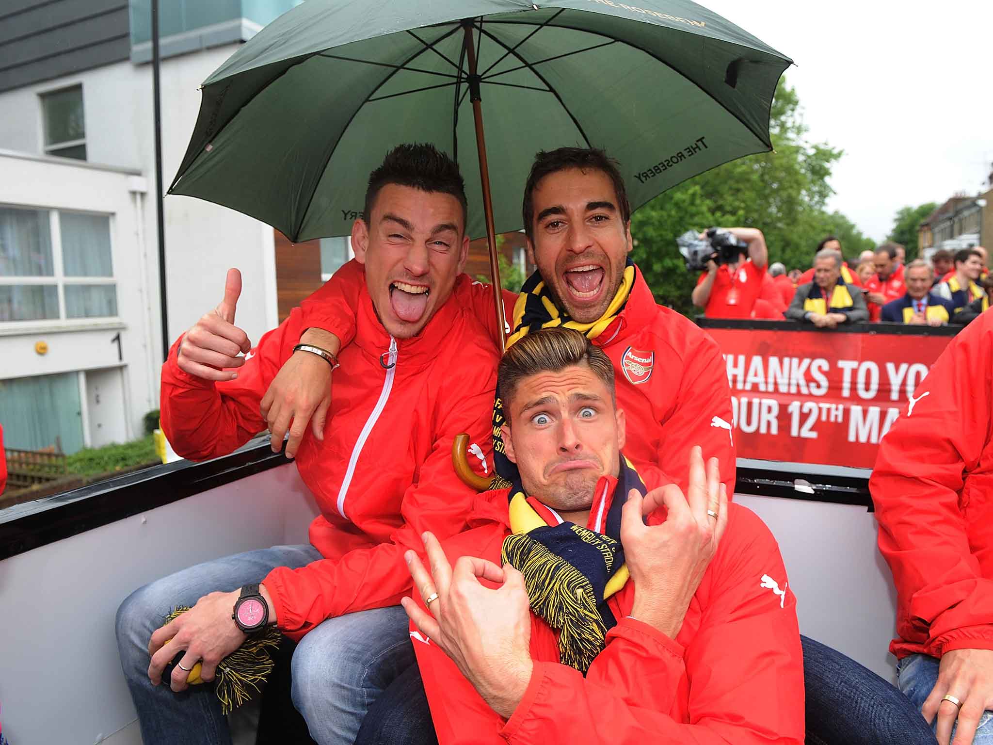 Giroud celebrates with Laurent Koscielny and Mathieu Flamini