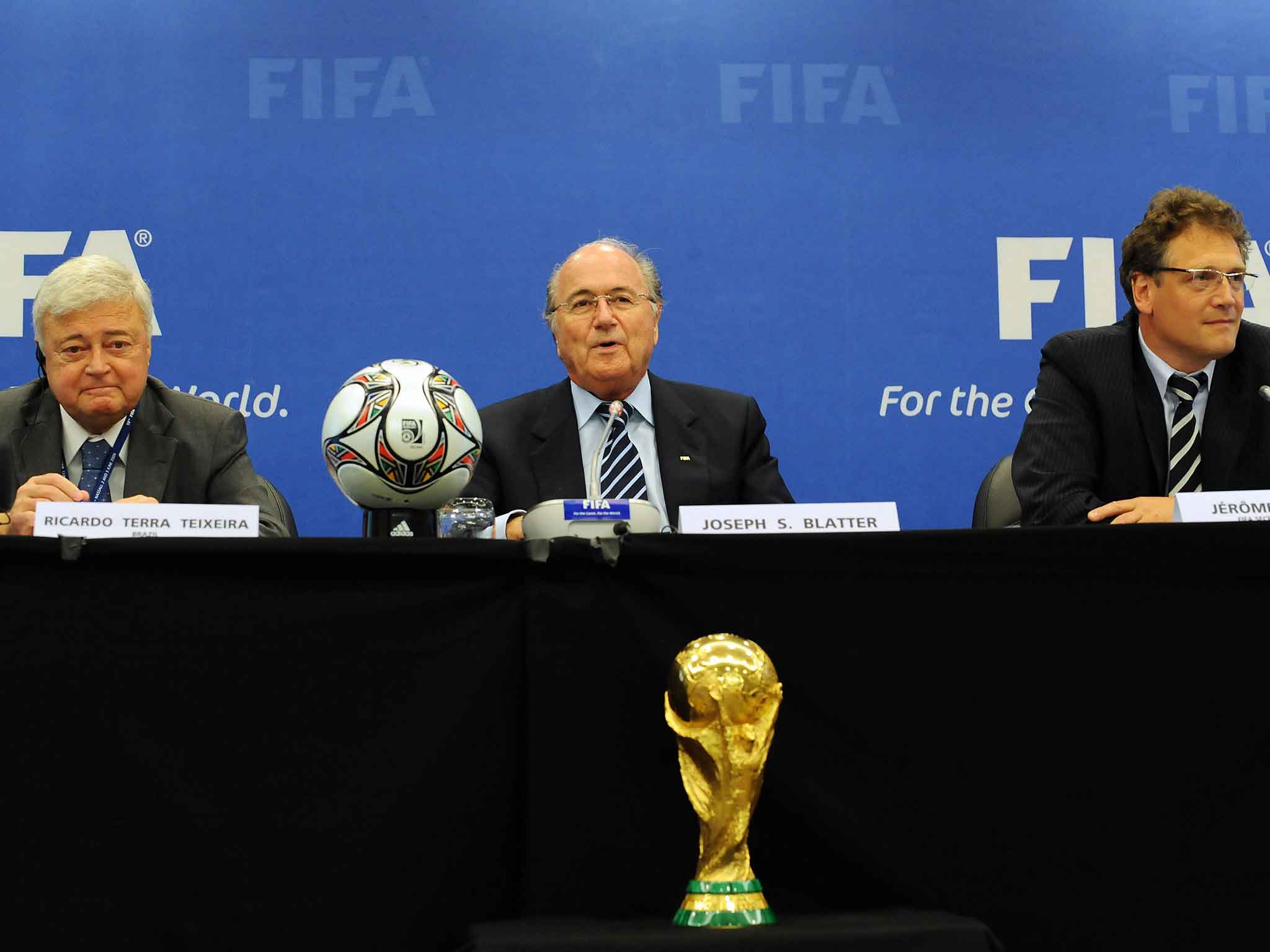 Teixeira (left) and Valcke (right) either side of Sepp Blatter