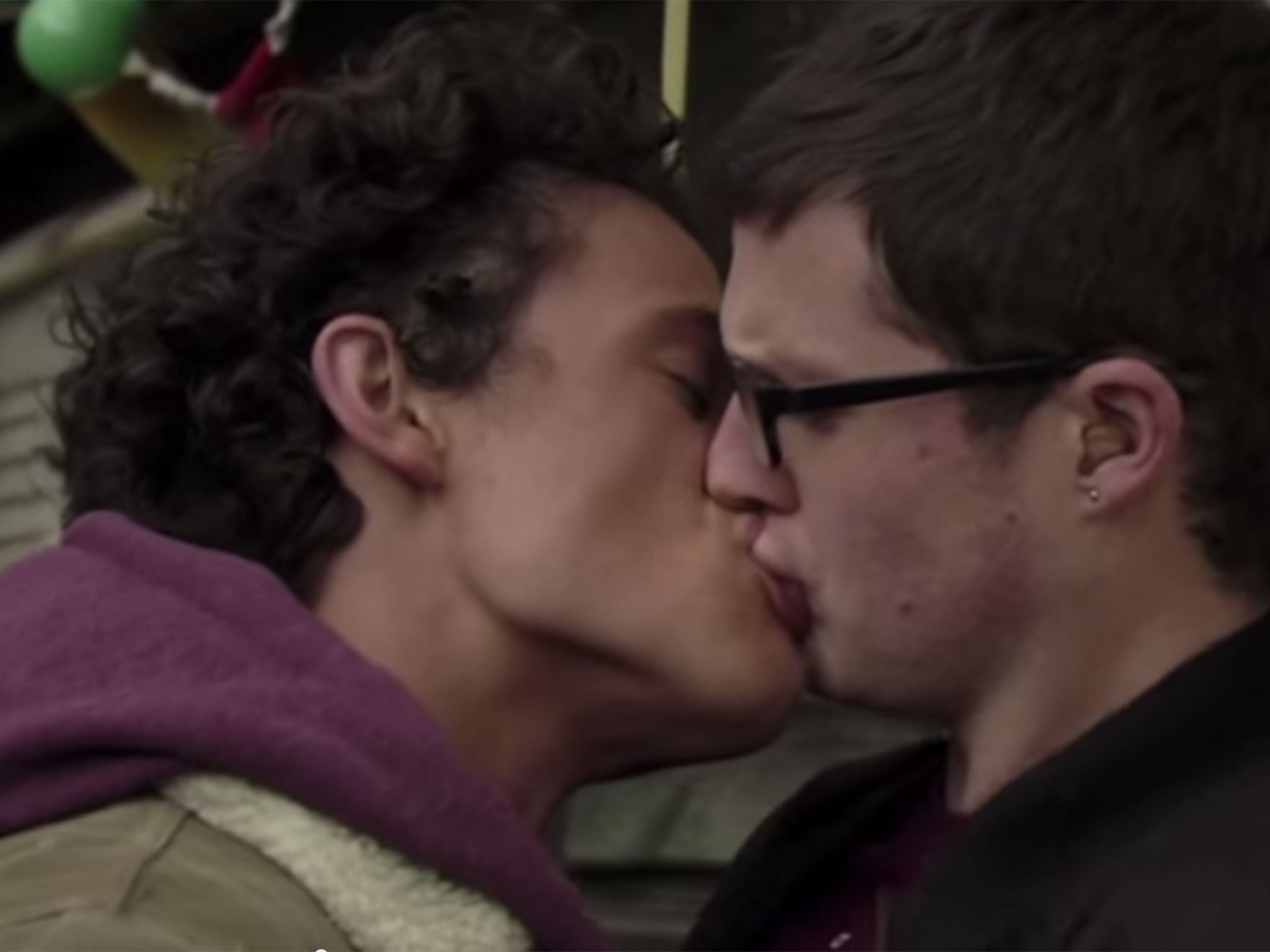 EastEnders characters share a kiss. Soap actors now use body doubles for intimate scenes due to coronavirus