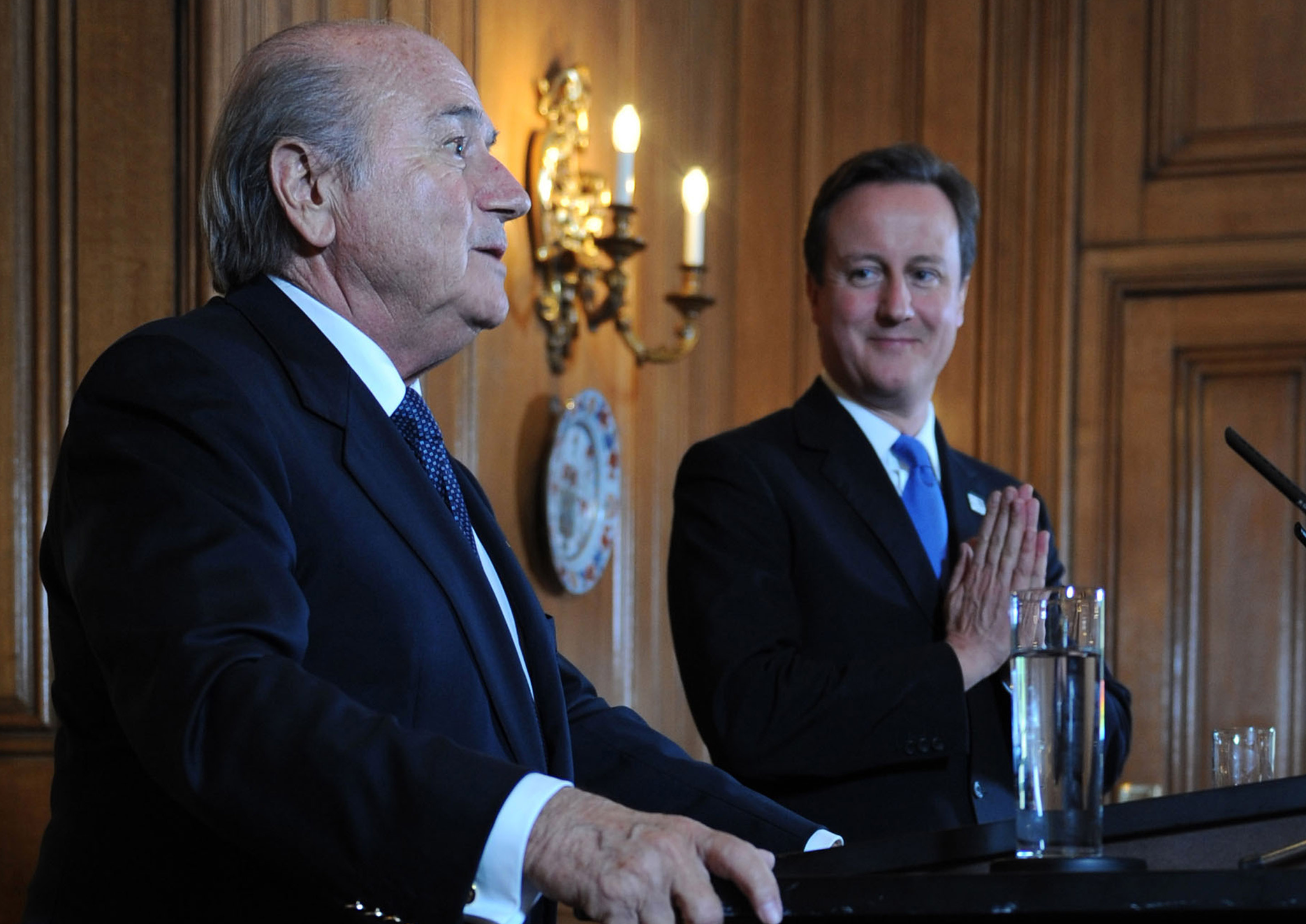 David Cameron looks on as Sepp Blatter speaks to the media at number 10 Downing Street on October 13, 2010