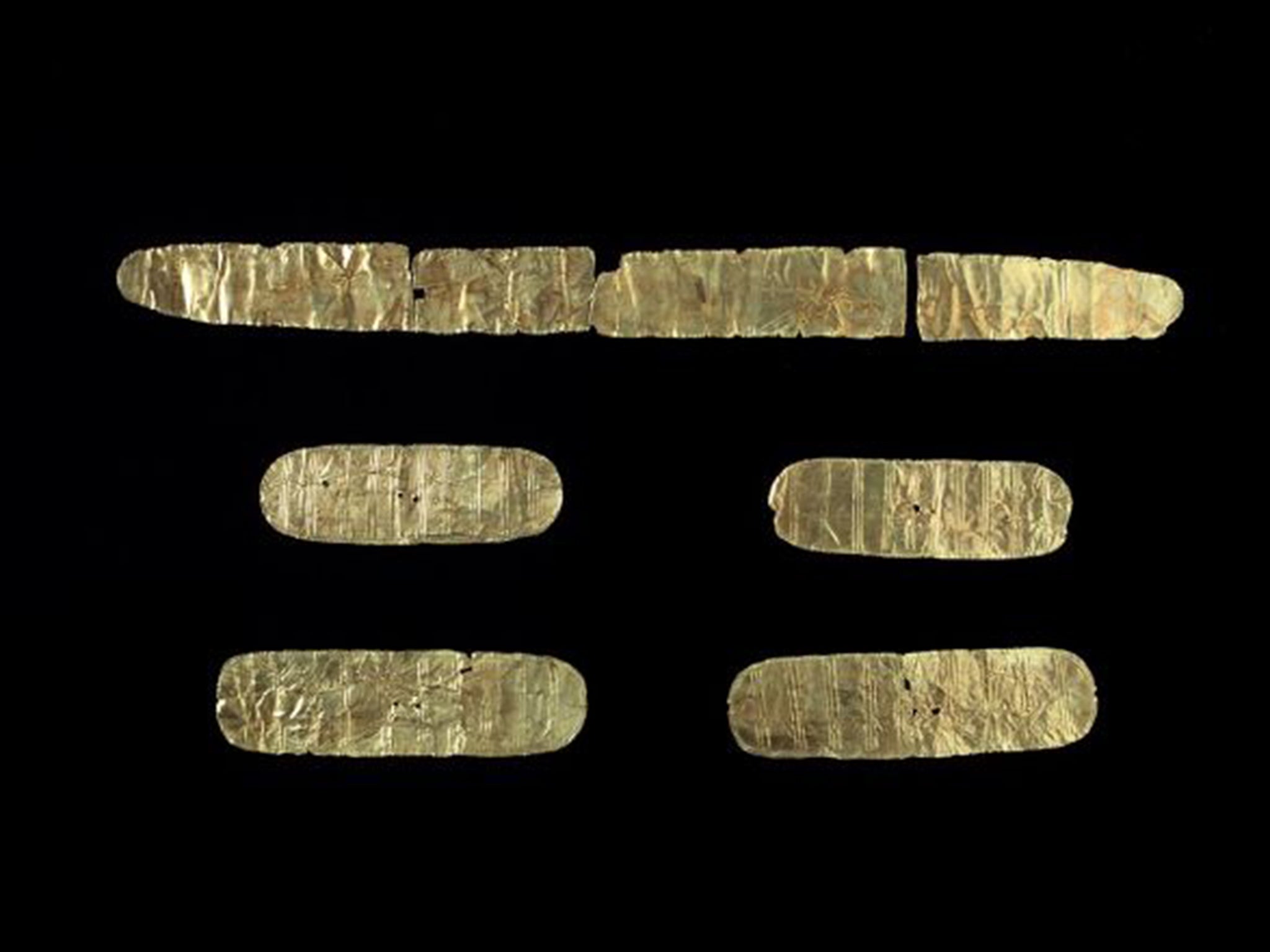 A breast plate, top, and plaques found in Ireland